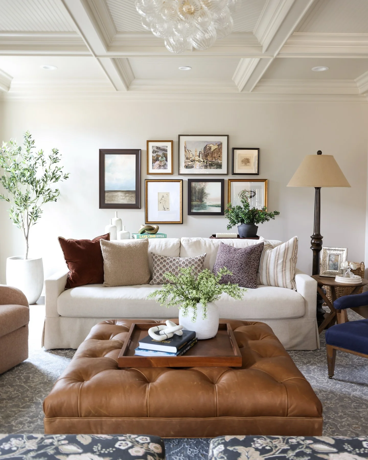 4. Eclectic Gallery Style with Leather Accents (Basement Living Room Ideas)