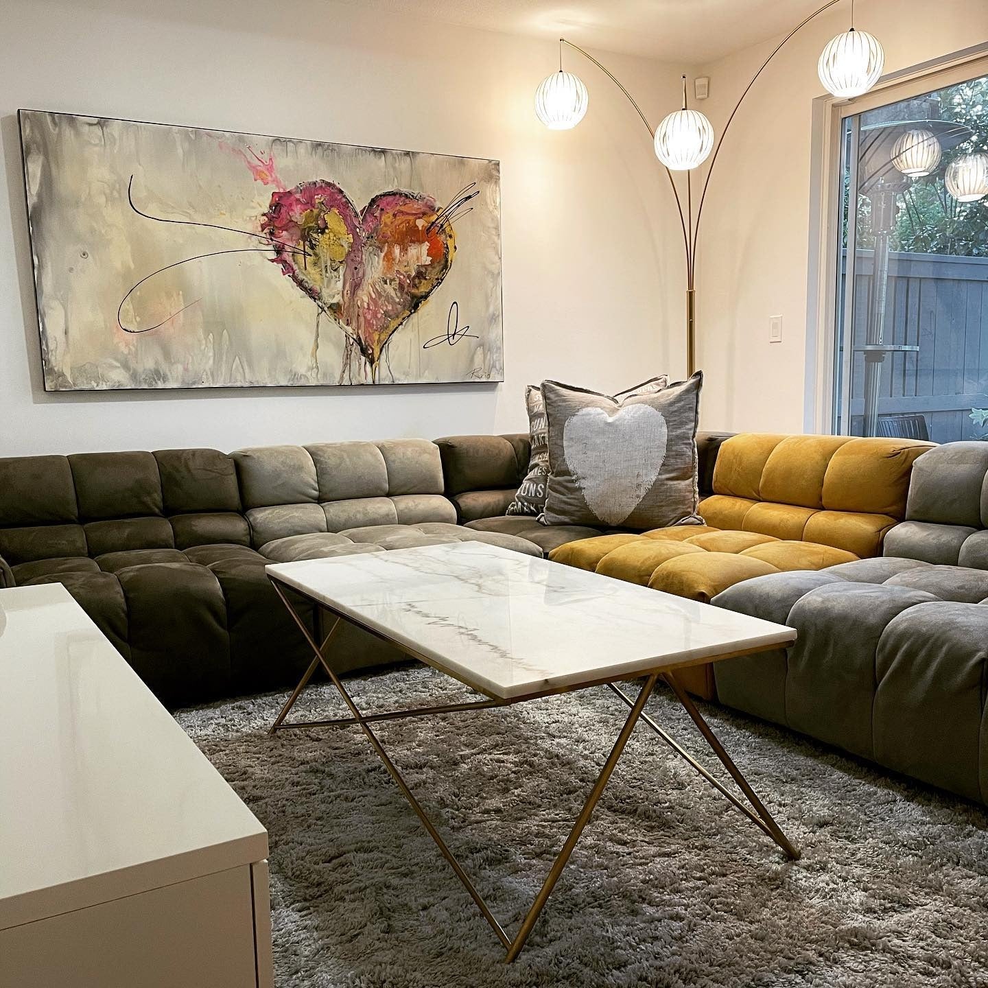 11. Artful Expression with Bold Seating (Basement Living Room Ideas)