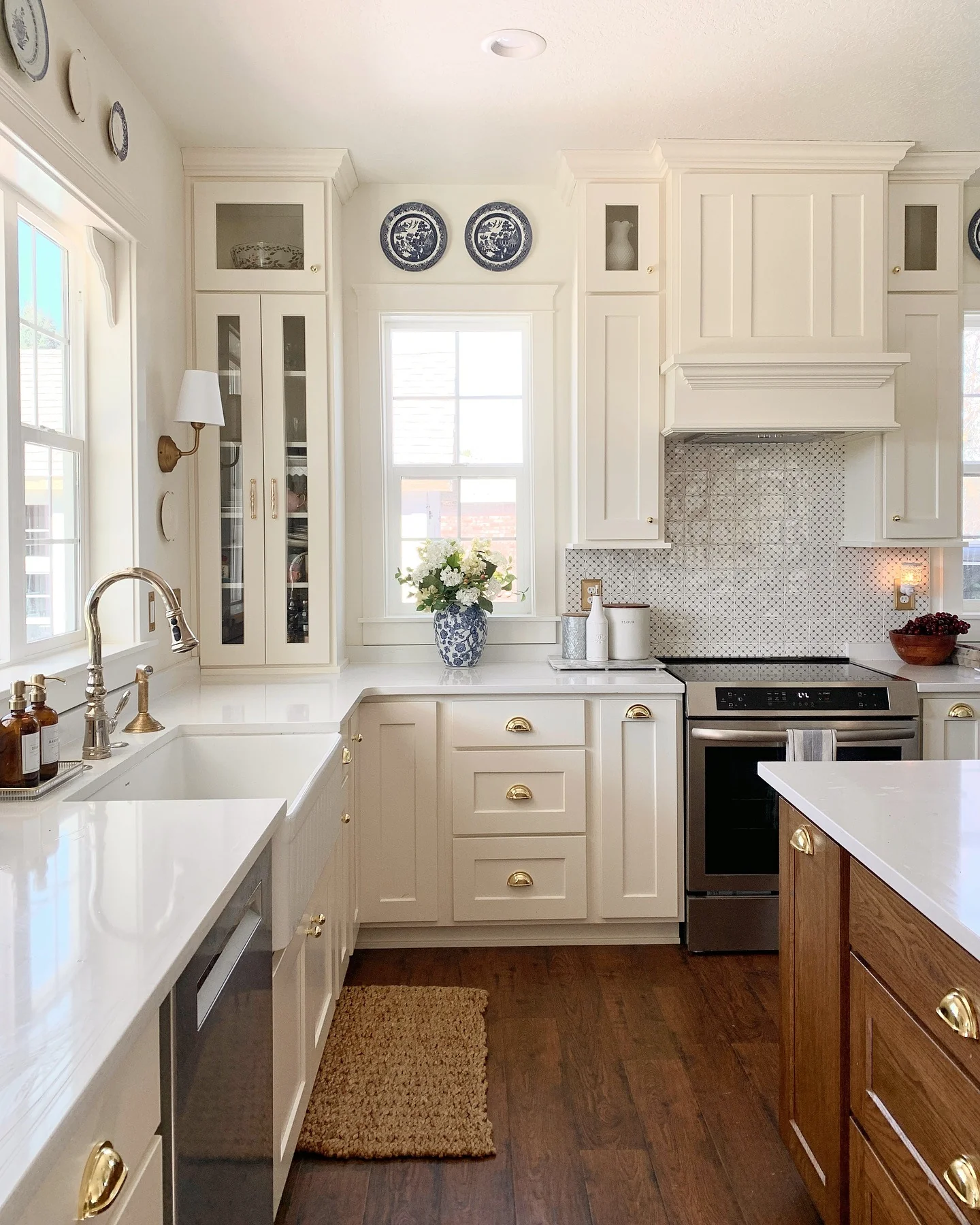 15. Soft White with Brass Cup Pulls (Kitchen Cabinet Paint Ideas)