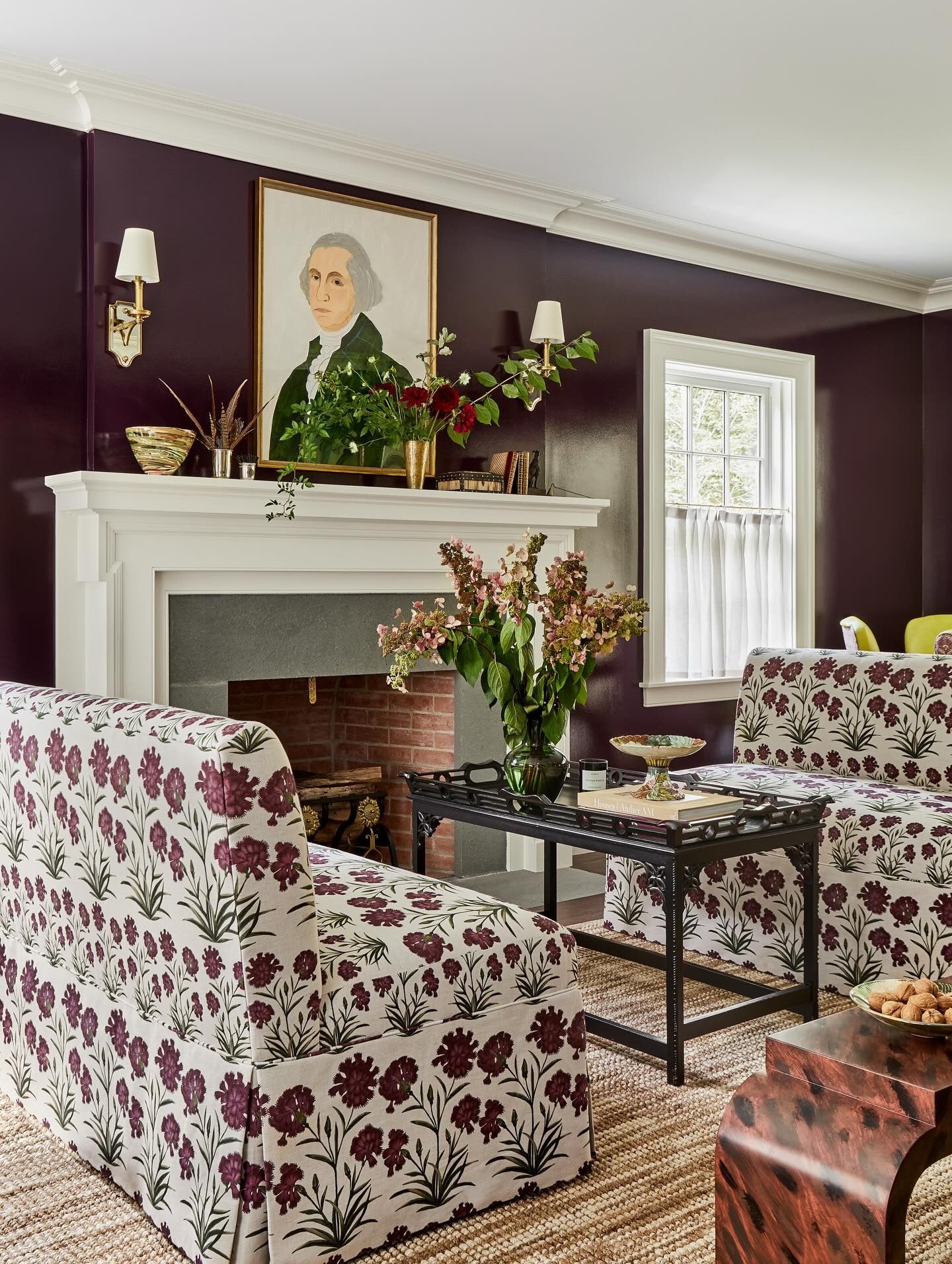 8. Plum Walls with Patterned Charm (Paint Ideas for Living Room)