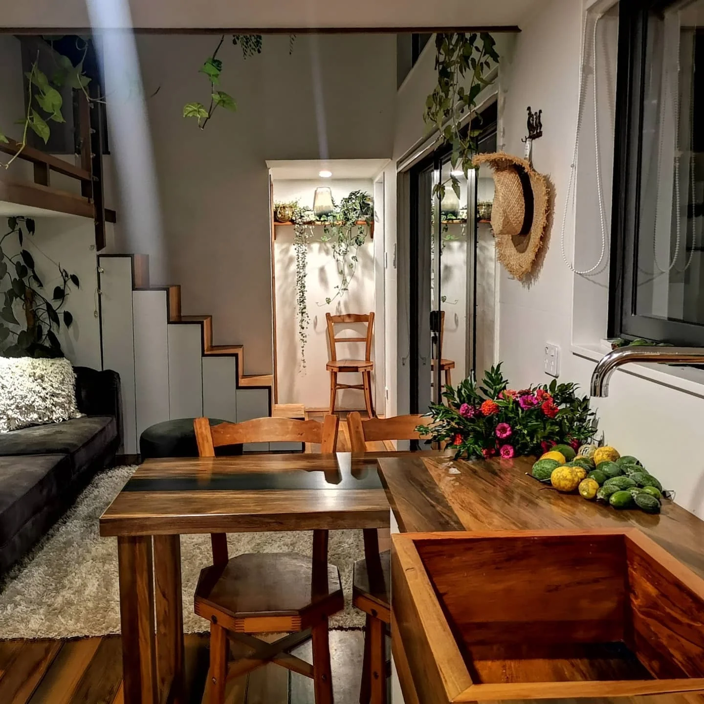 5. Rustic Wood Kitchen with Botanical Accents (Tiny House Kitchen Ideas)
