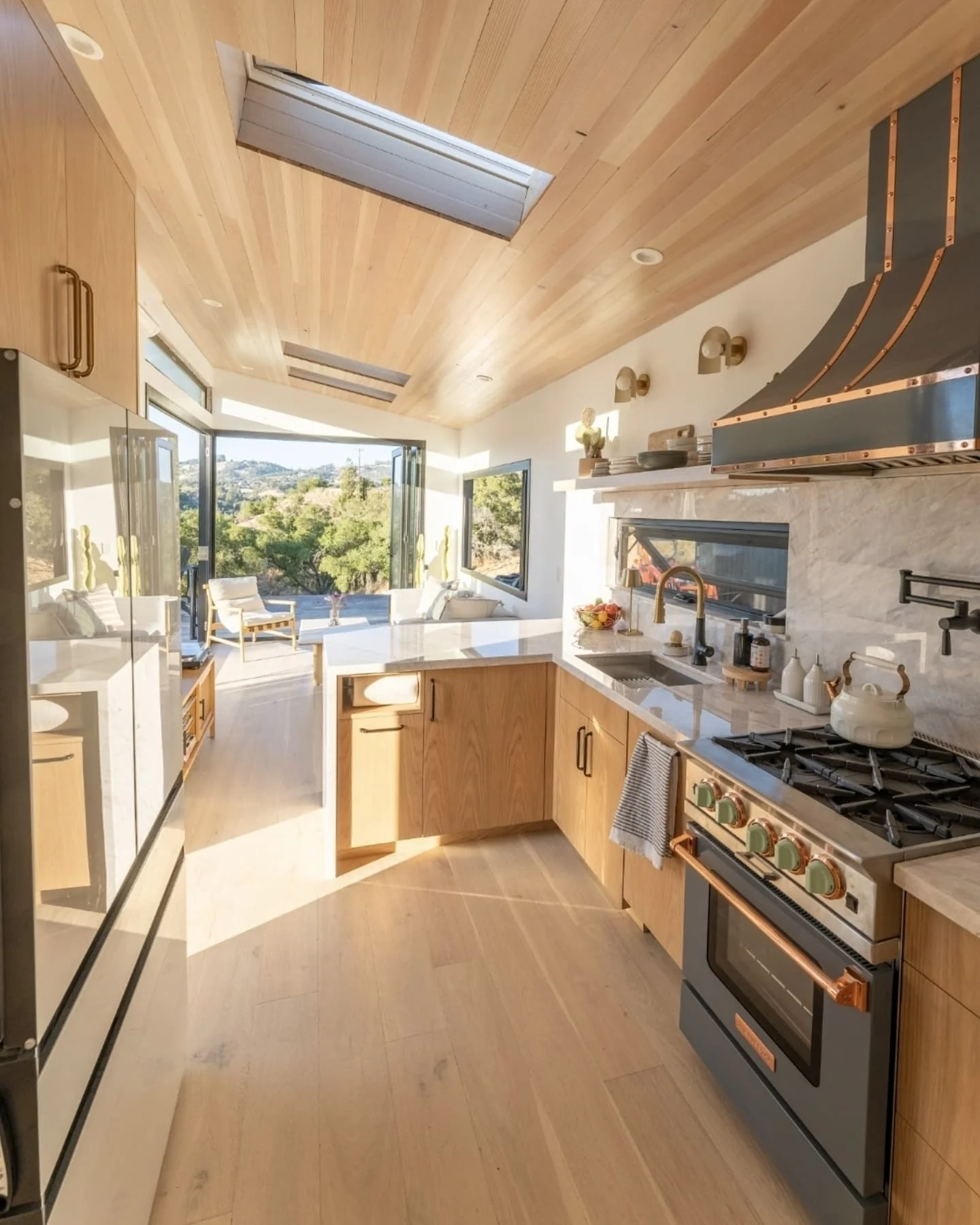 4. Modern Lightwood Kitchen with Open Views (Tiny House Kitchen Ideas)