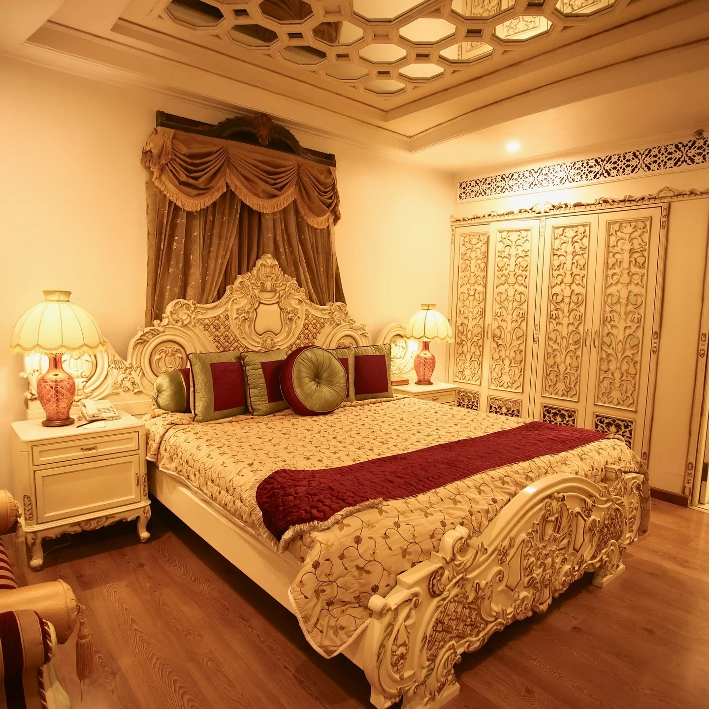 13. Regal Ruby and Gold Opulence (Royal Bedroom Ideas)