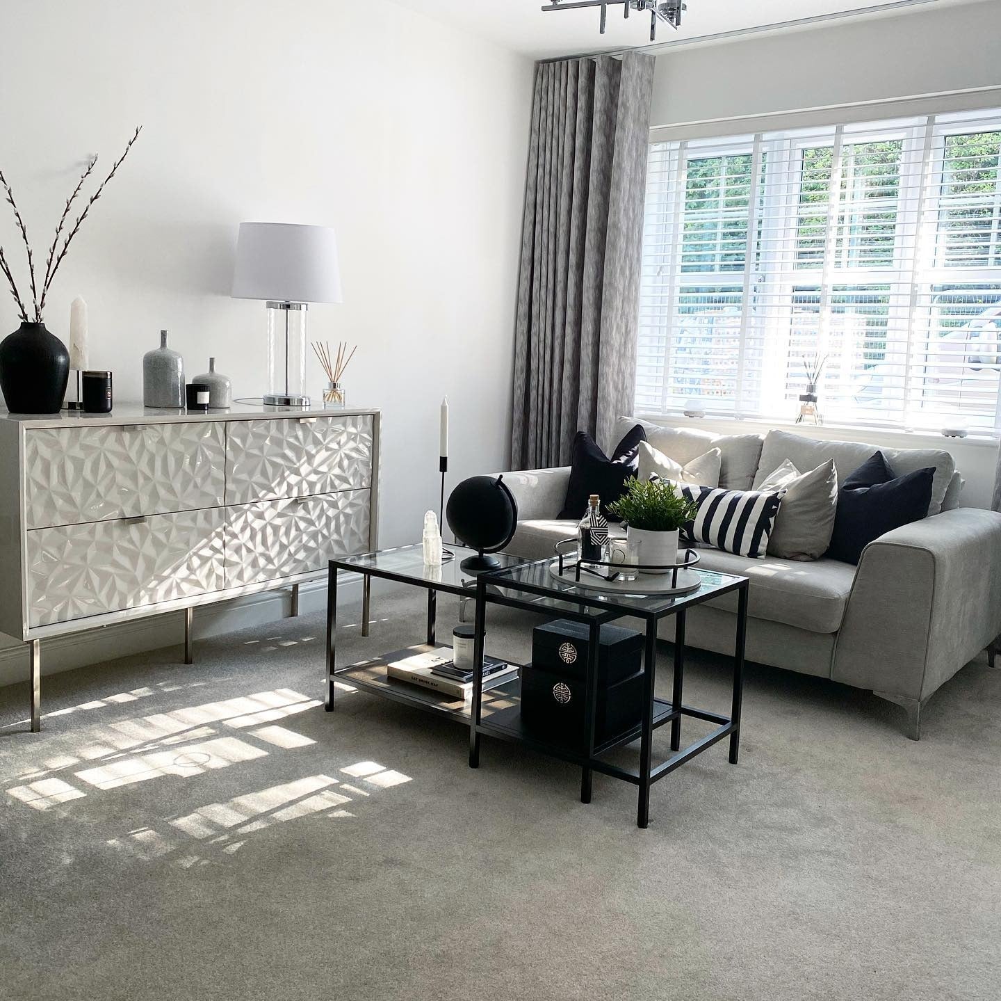 6. Refined Monochrome with Gloss Accents (Grey, Black and White Living Room Ideas)