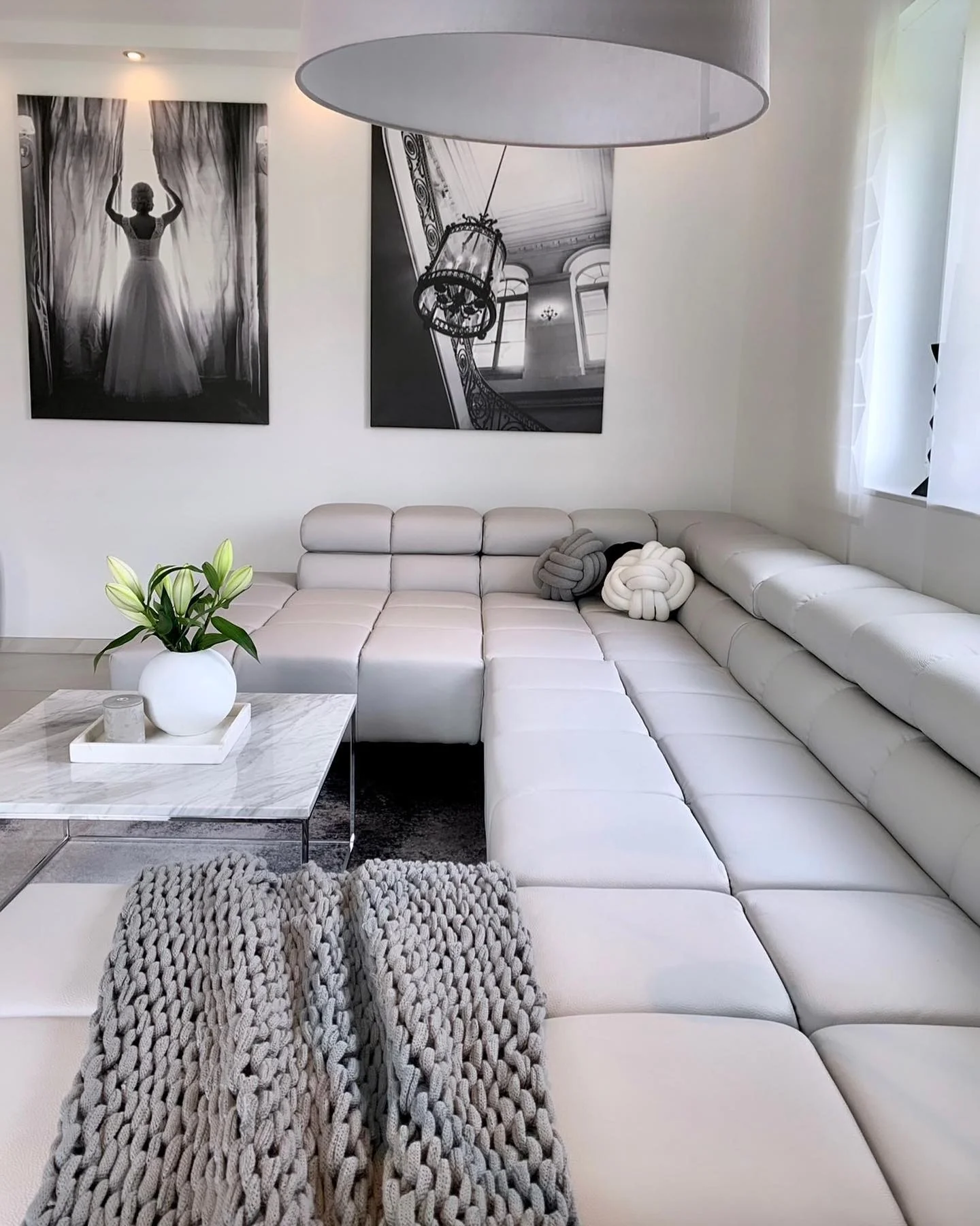 8. Contemporary Comfort with Sculptural Art (Grey, Black and White Living Room Ideas)