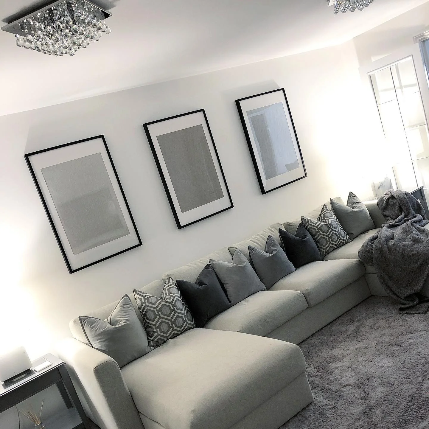 10. Soft Grey Ensemble with Plush Accents (Grey, Black and White Living Room Ideas)