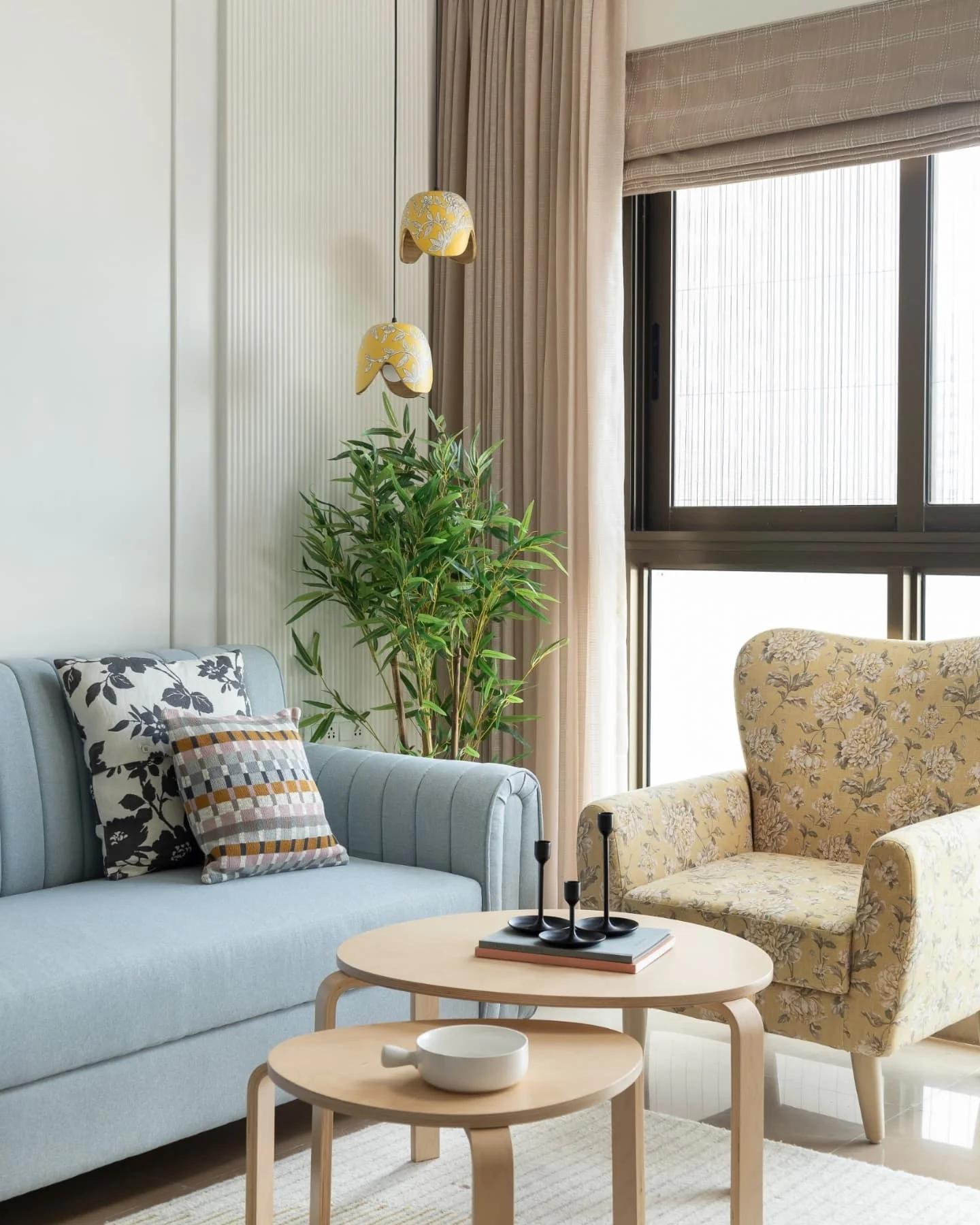 4. Soft Florals with Scandinavian Simplicity (Yellow and Blue Living Room Ideas)