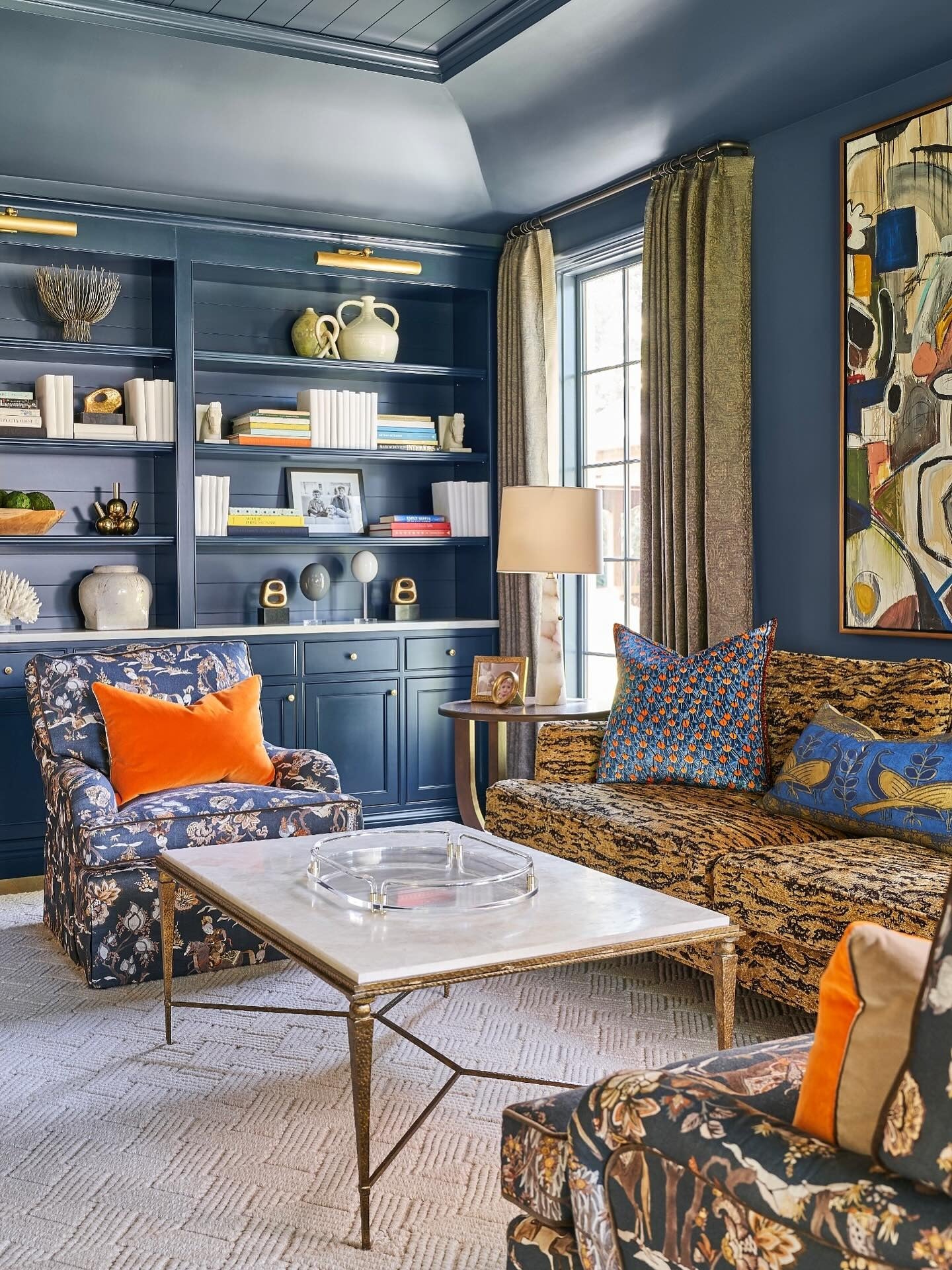 10. Art Collector’s Lounge in Ink and Amber (Yellow and Blue Living Room Ideas)