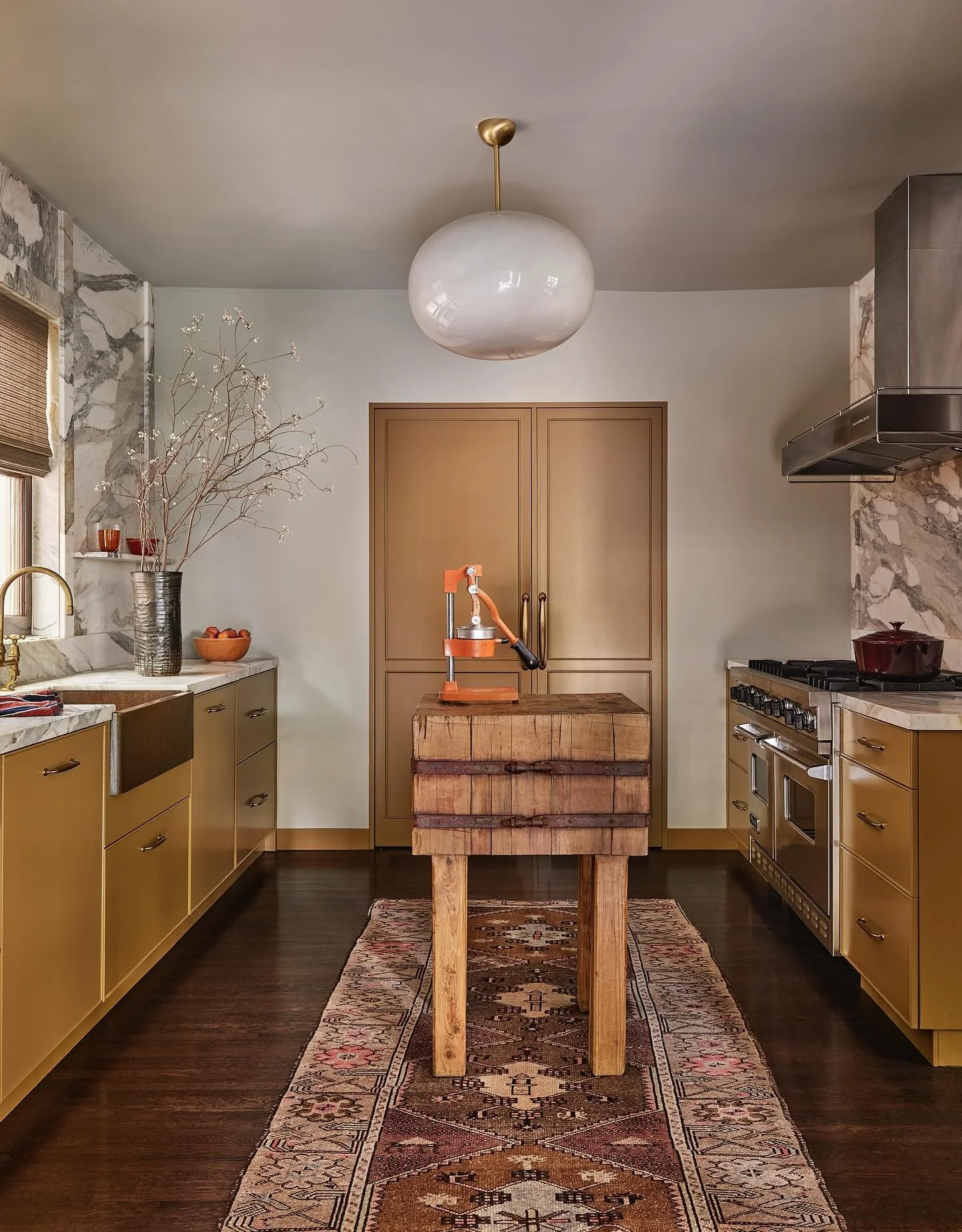 2. Vintage Brass and Butcher Block Drama (Kitchen Rug Ideas)