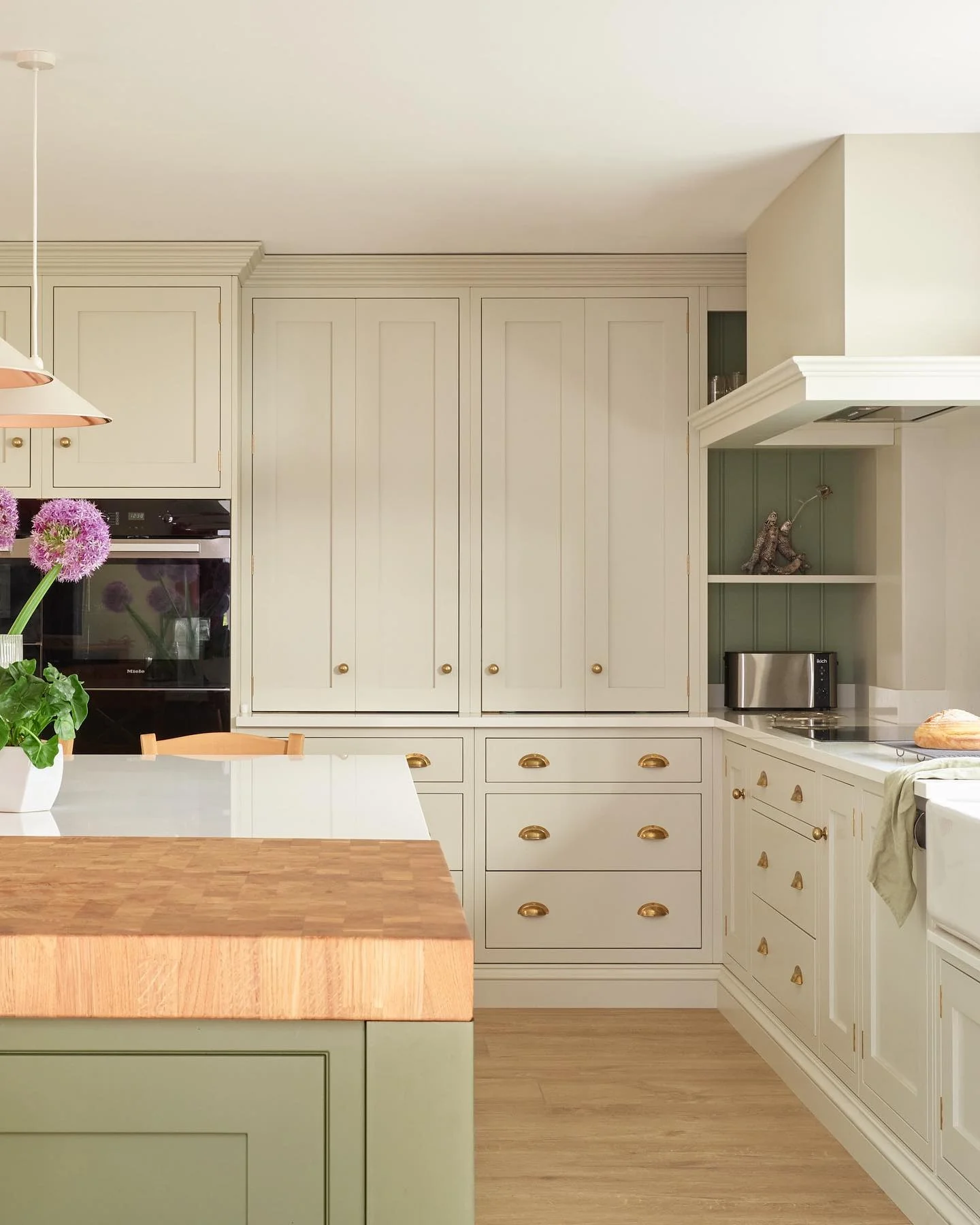 9. Olive & Bone: Country Chic with a Polished Twist (Two Tone Kitchen Ideas)