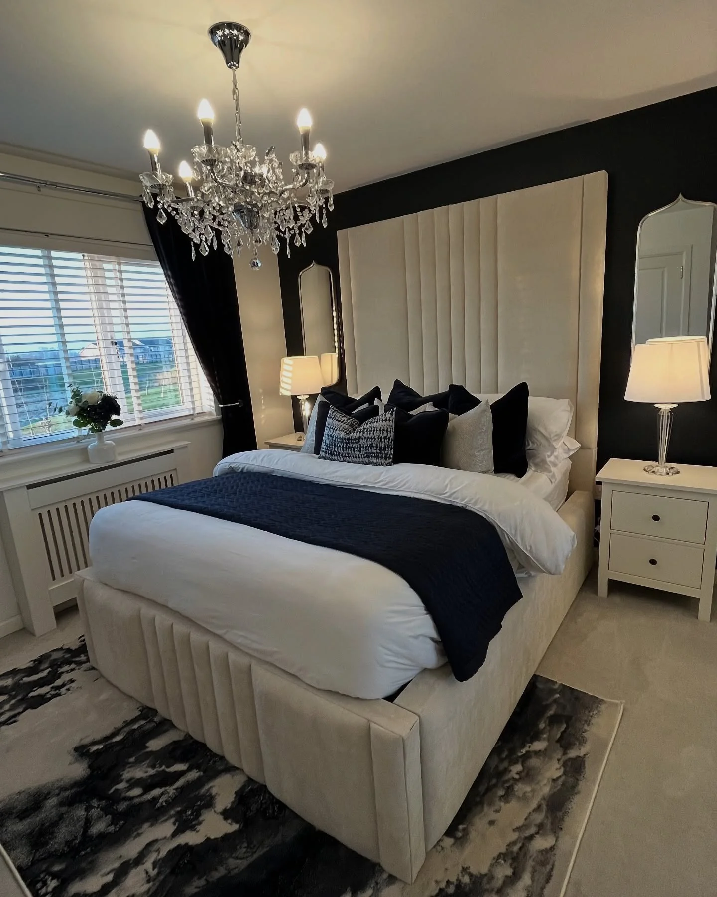 4. Dramatic Paneling with Crystal Detail (Black and Cream Bedroom Ideas)