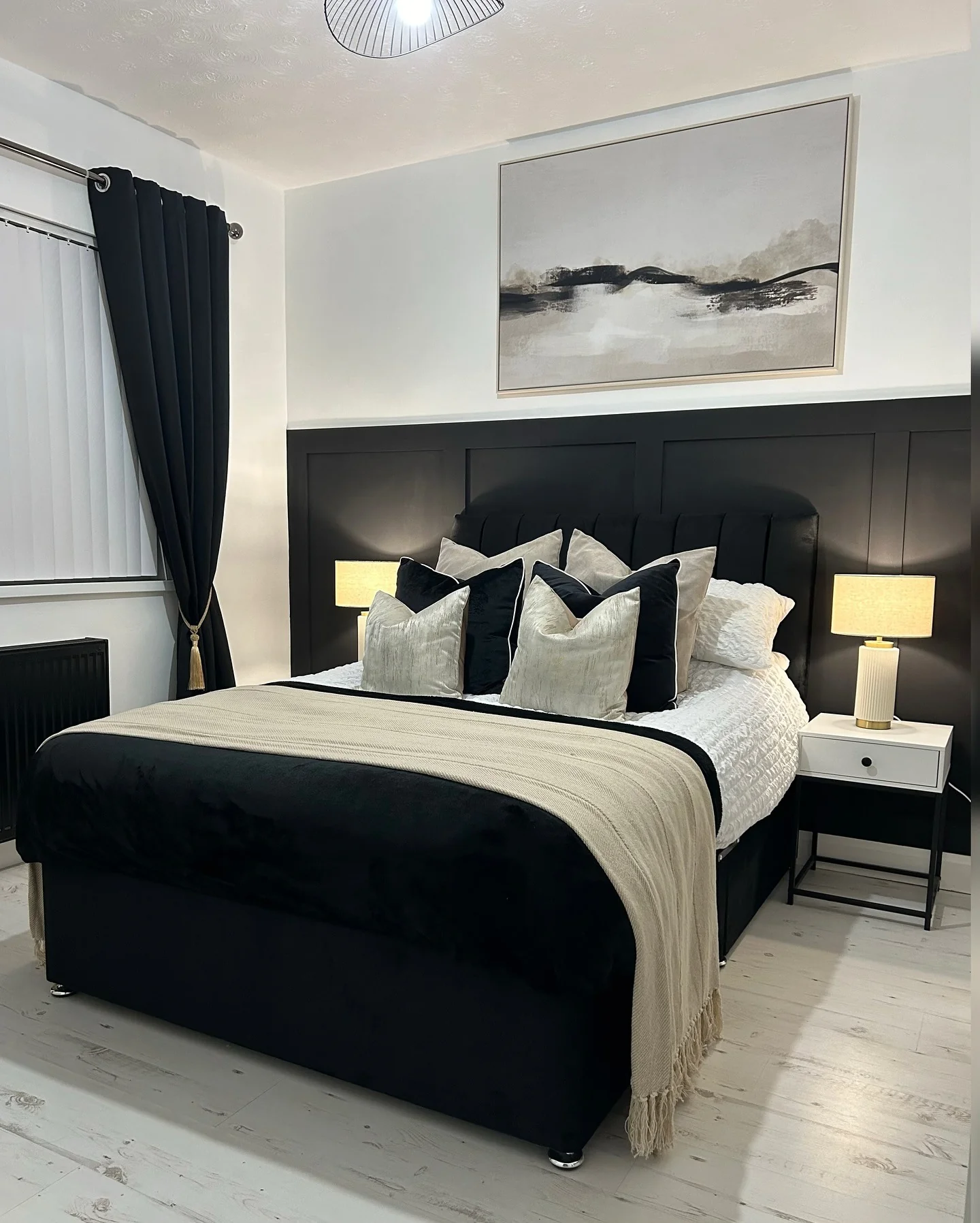 12. Crisp Contrast with Panel Detailing (Black and Cream Bedroom Ideas)
