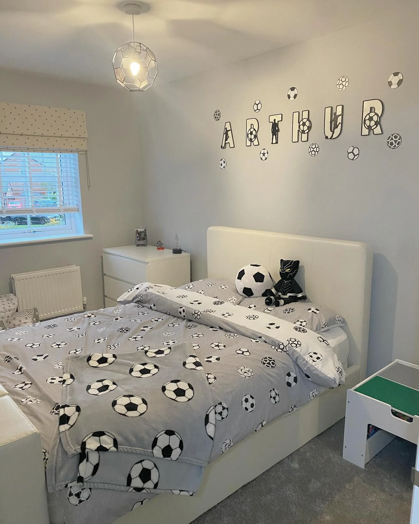 2. Soft Grays with Personalized Touch (Football Bedroom Ideas)