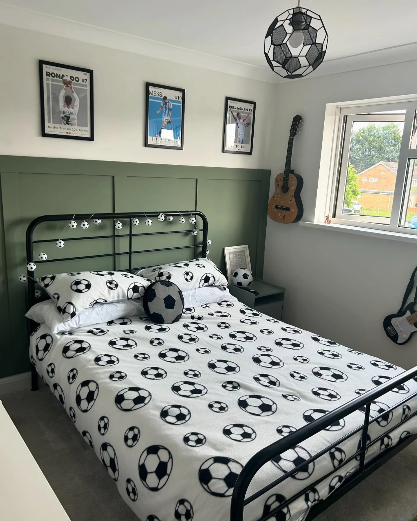 6. Minimalist Green Paneling & Classic Prints (Football Bedroom Ideas)
