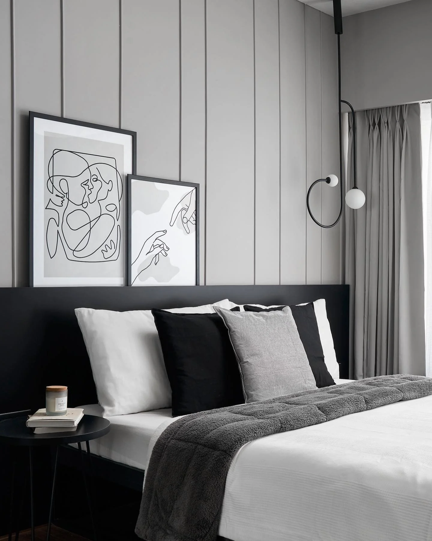 4. Monochrome Framing with Graphic Art (Grey Wall Bedroom Ideas)