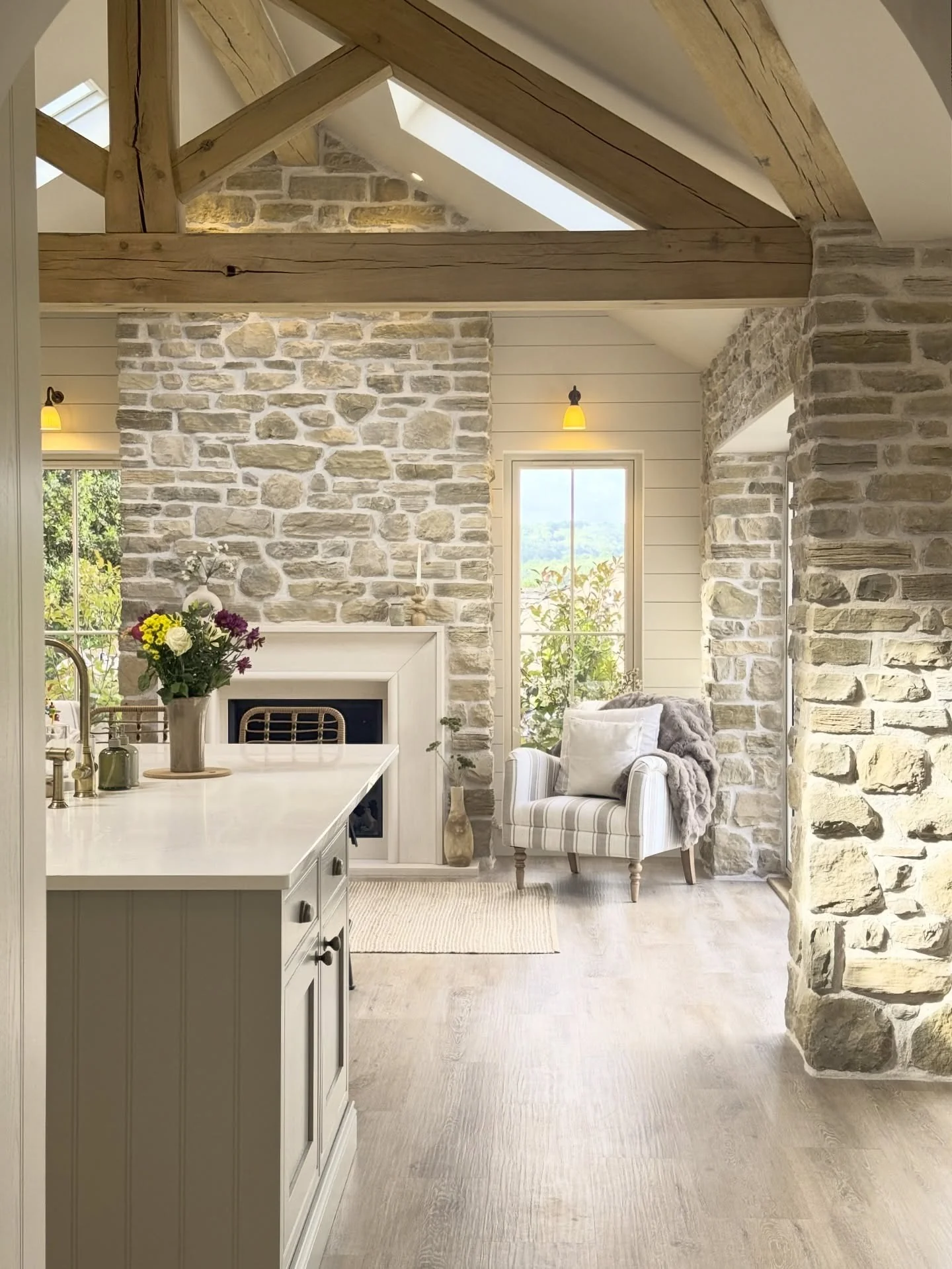 4. Stonework Charm with Soft Neutrals (Open Lounge Kitchen Ideas)