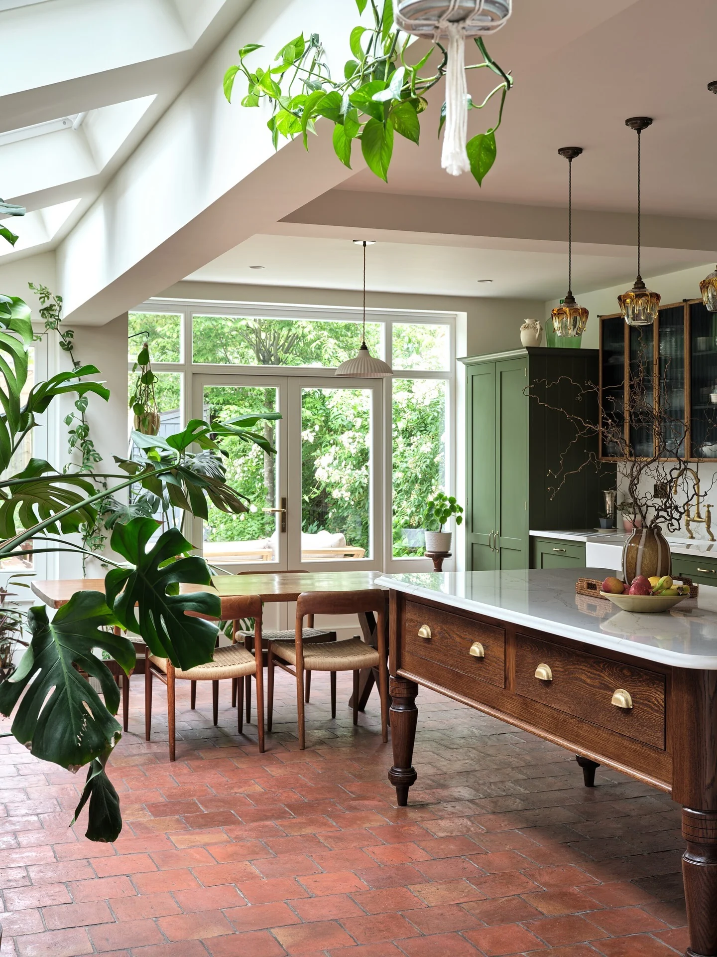 12. Green Cabinetry with Brick Flooring (Open Lounge Kitchen Ideas)