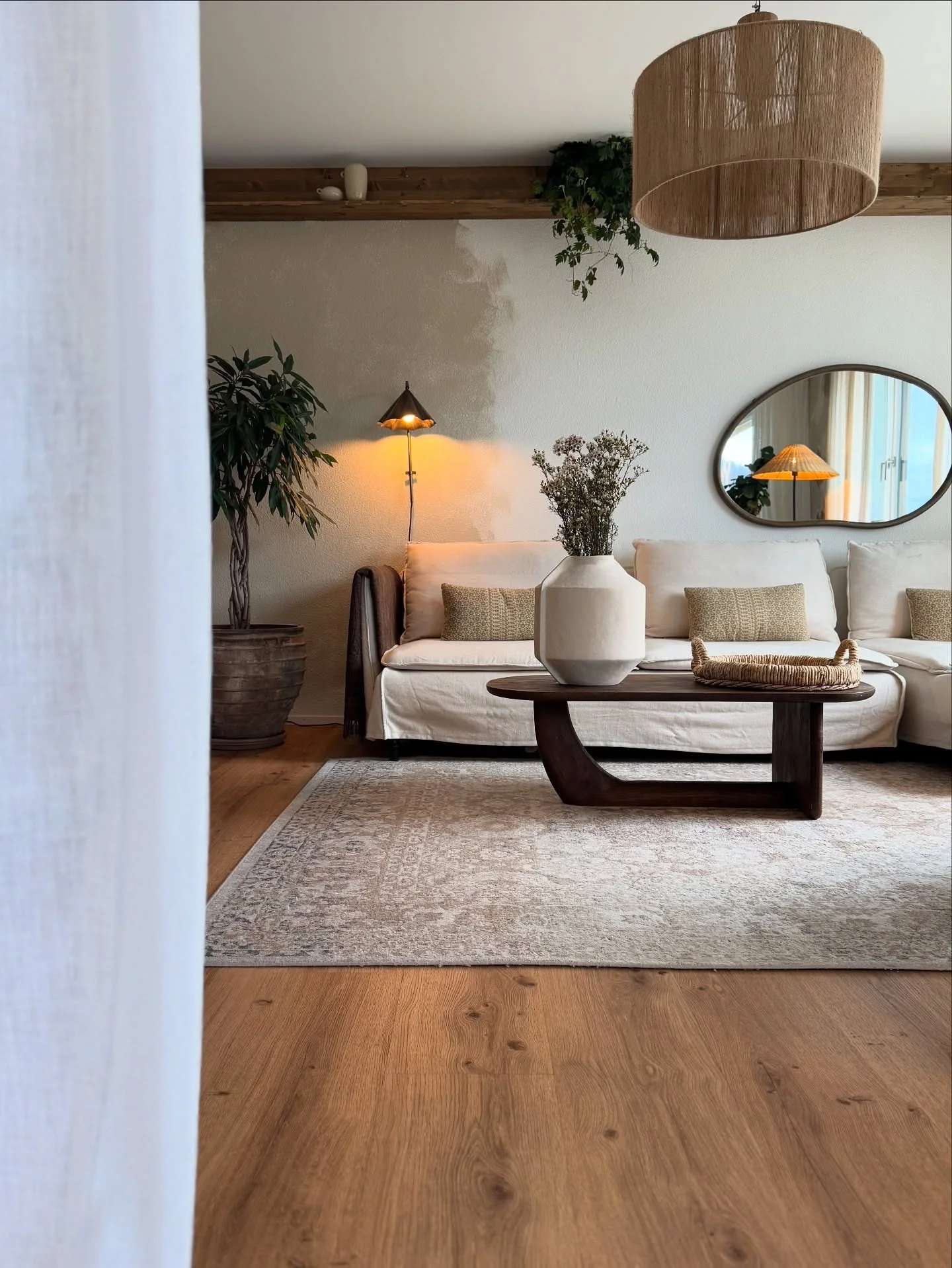 3. Organic Calm with Earthy Layers (Dark Wood Floor Living Room Ideas)