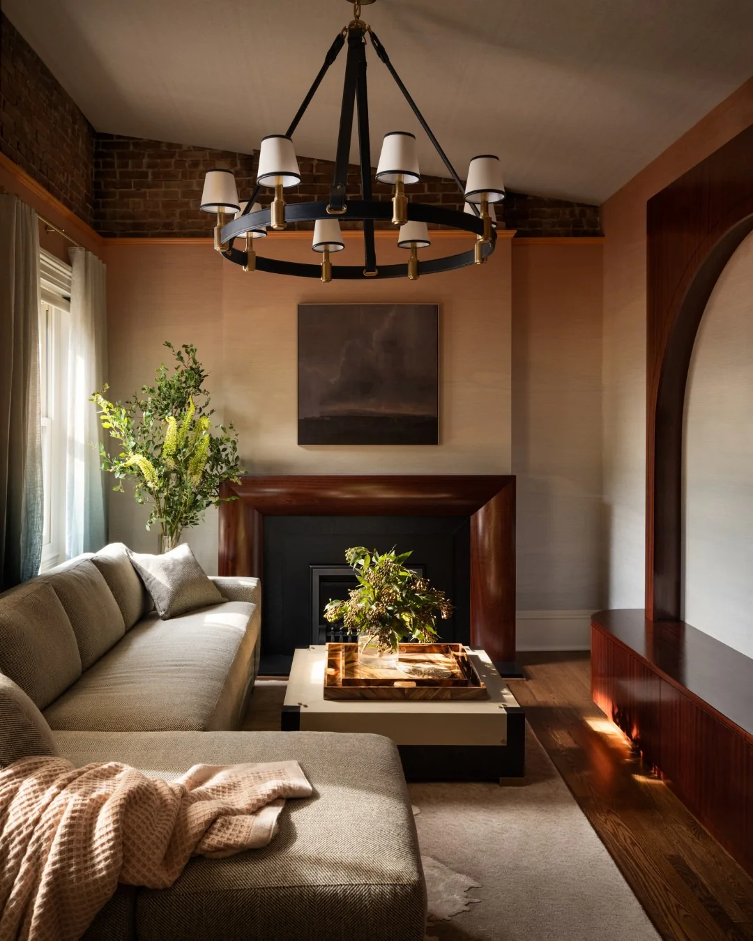 5. Urban Sophistication with Dramatic Structure (Dark Wood Floor Living Room Ideas)