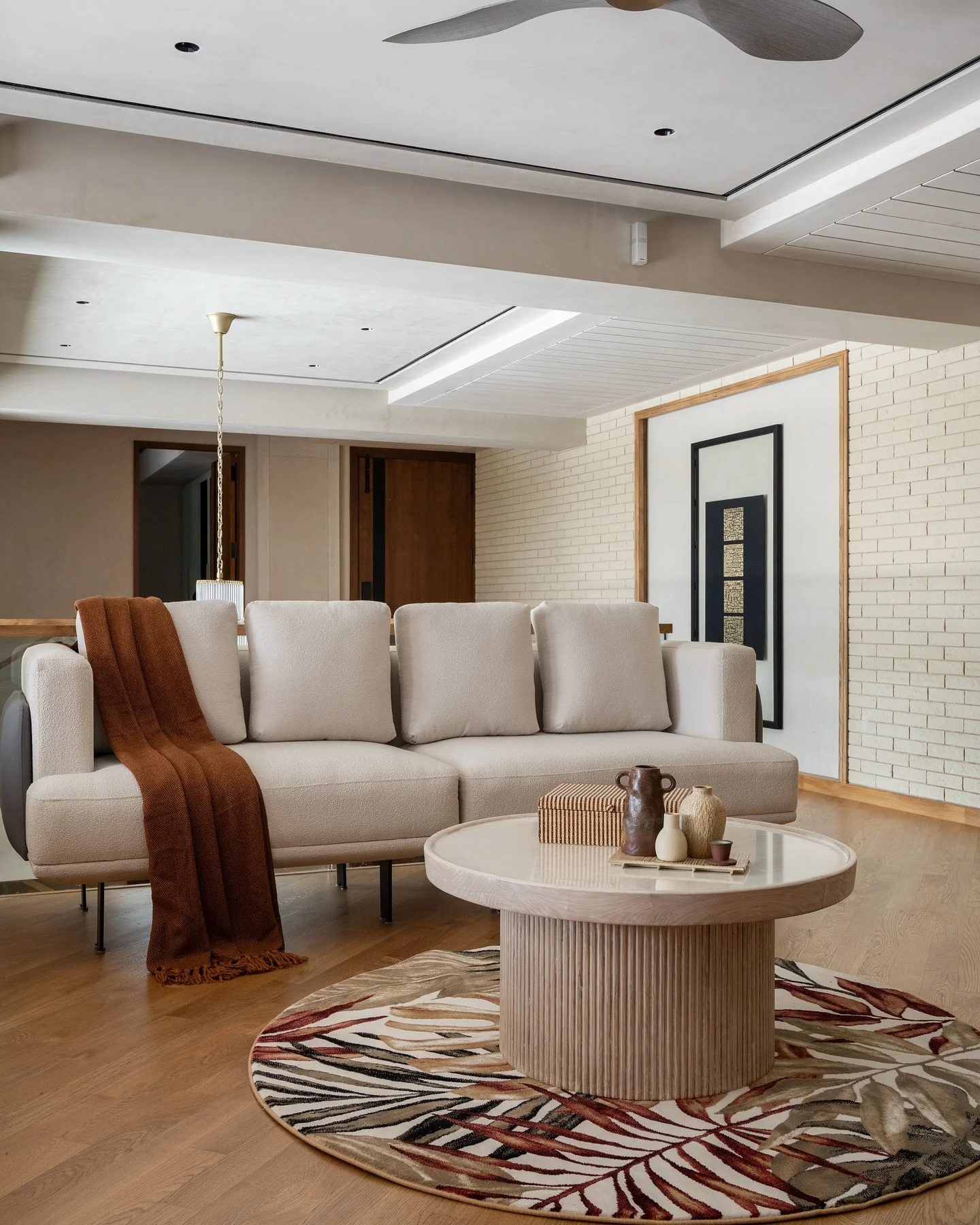 8. Curated Modernism with a Pop of Pattern (Dark Wood Floor Living Room Ideas)