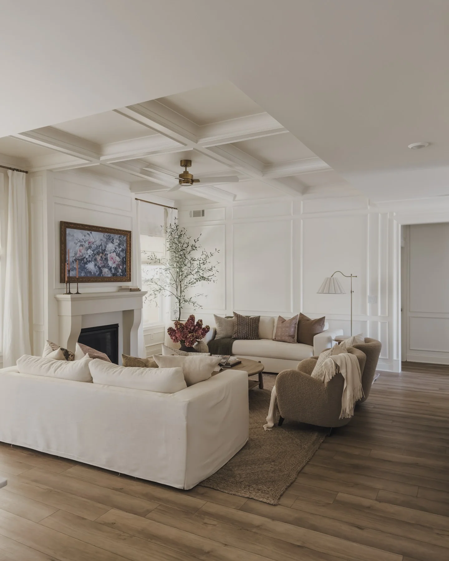 15. Classic White with Panel Detailing and Soft Neutrals (Dark Wood Floor Living Room Ideas)