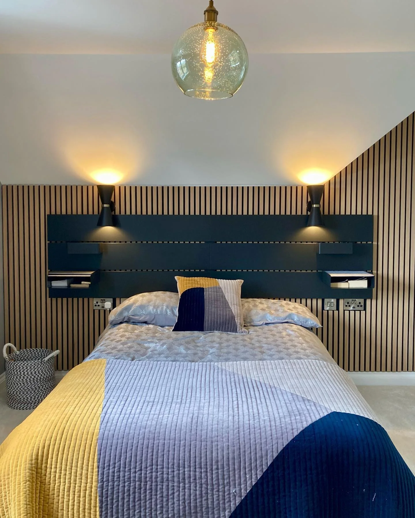 16. Slatted Wood Accent with Geometric Quilts (Cool Bedroom Ideas)