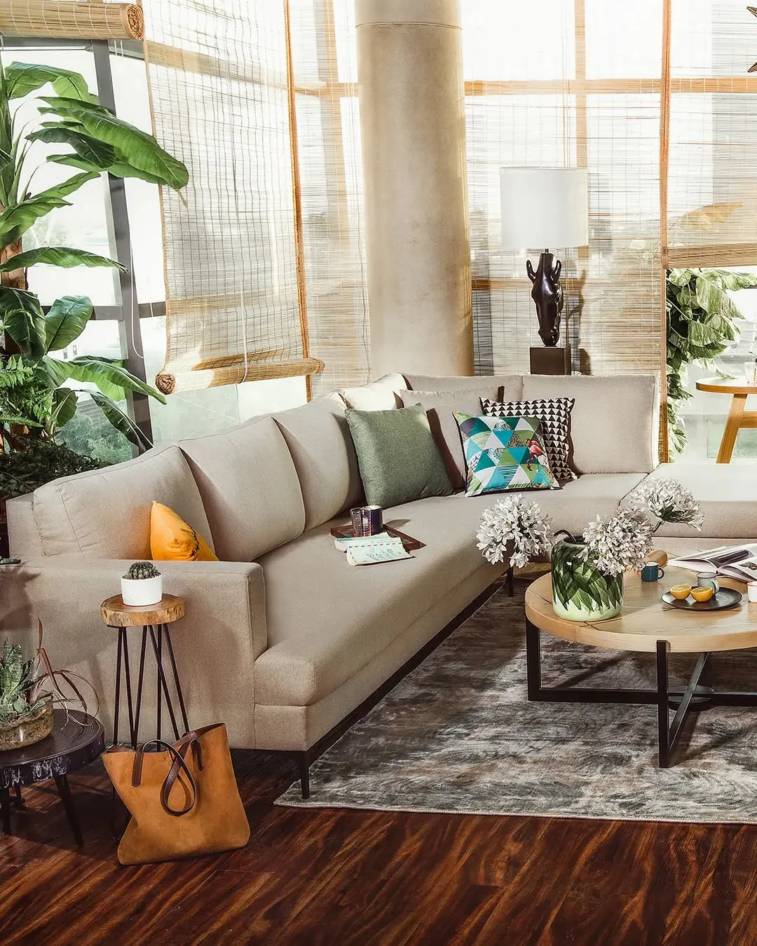 2. Warm Contemporary Comfort with Eclectic Pops (Sectional Living Room Ideas)