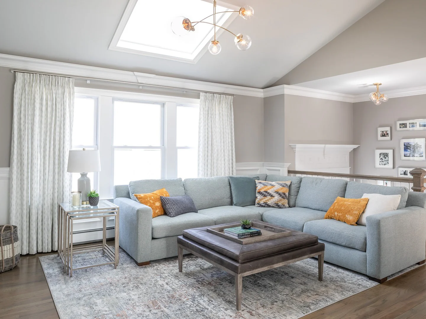 3. Sky-Blue Relaxation with Mid-Century Accents (Sectional Living Room Ideas)