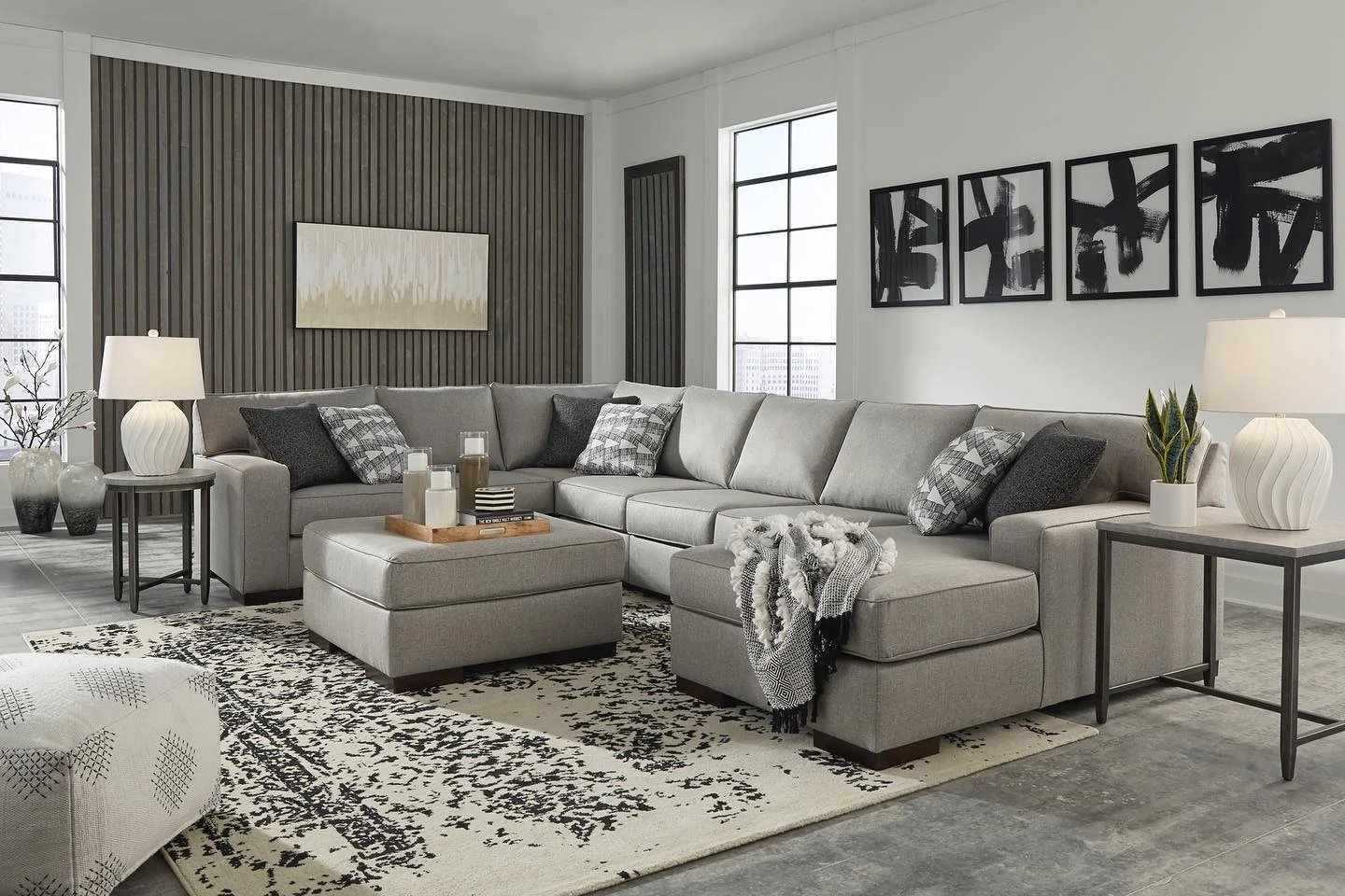 5. Textured Charcoal Layers with a Graphic Edge (Sectional Living Room Ideas)