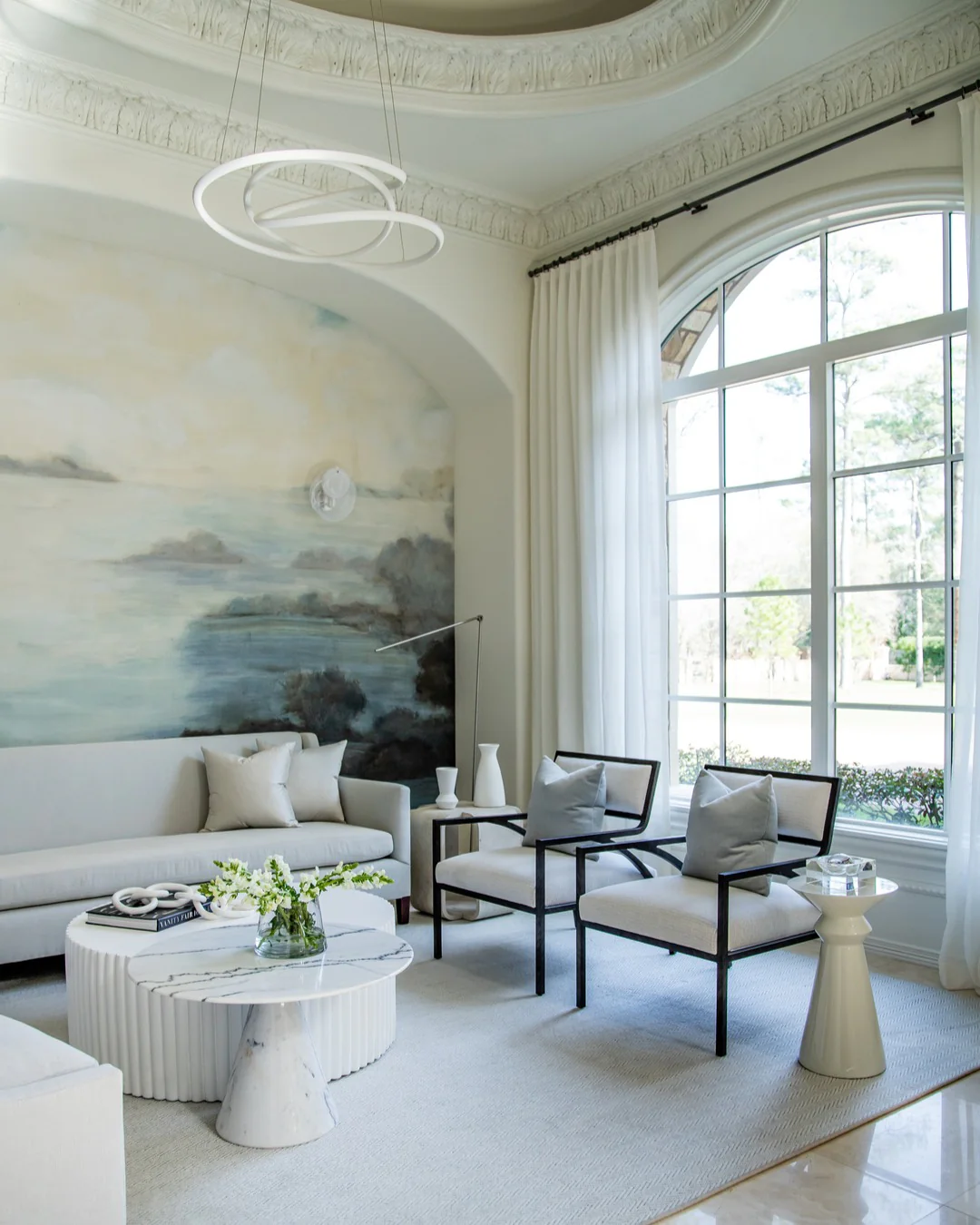 11. Soft Coastal Neutrals with Artistic Wall Murals (Elegant Living Room Ideas)