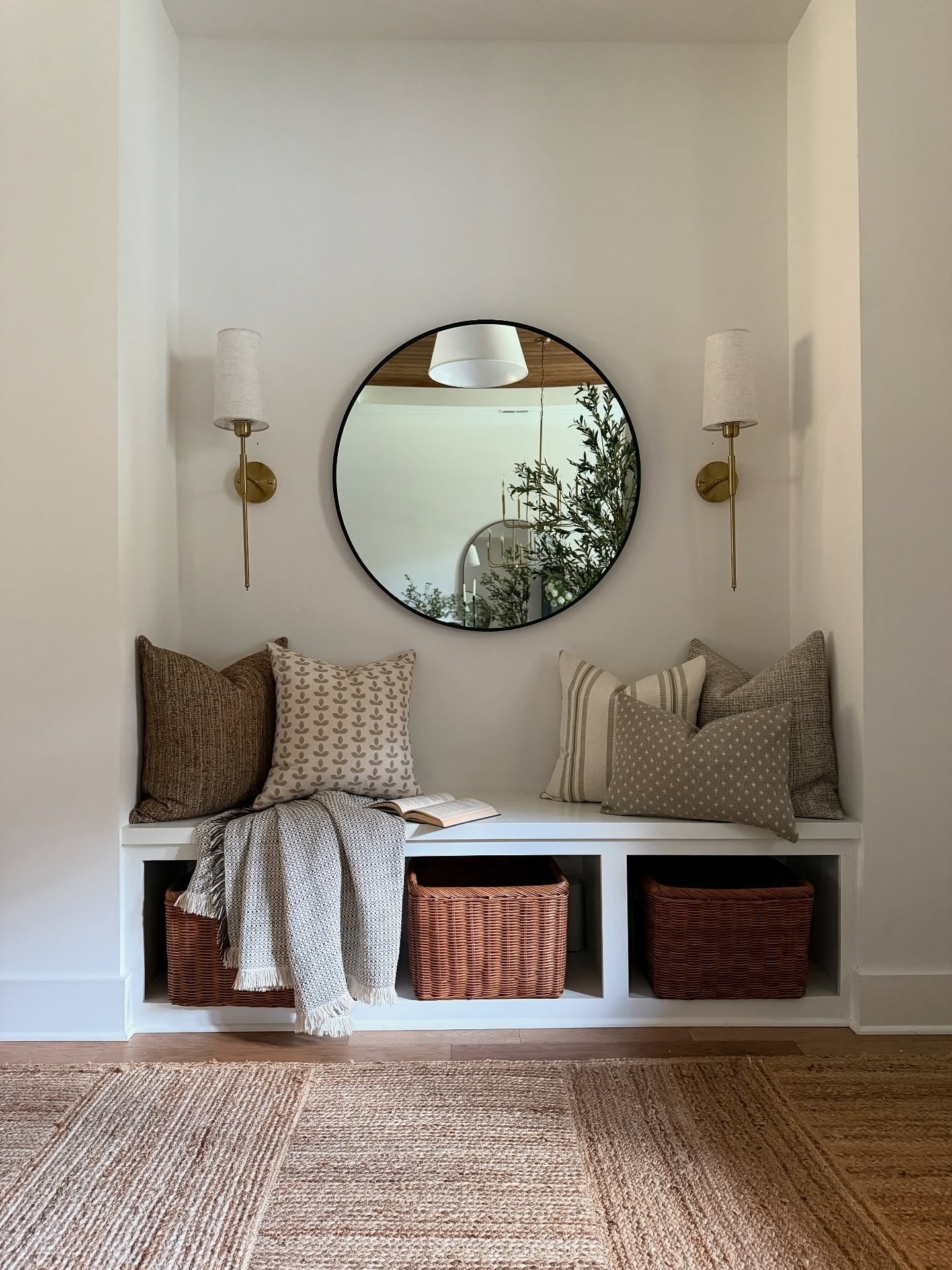2. Warm Neutrals in a Cozy Entry Nook (Mirrors in Living Room Ideas)