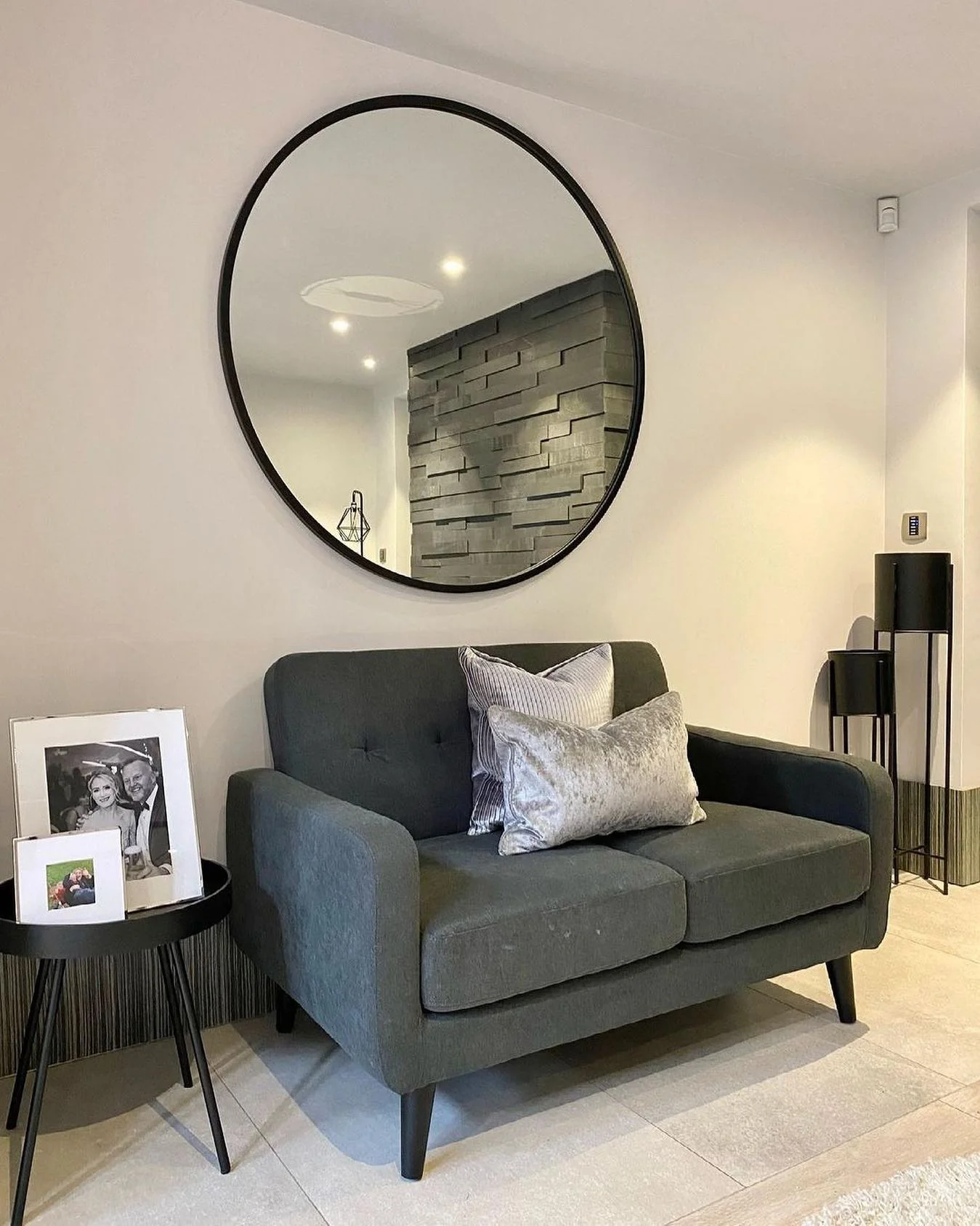 3. Moody Monochrome with Contemporary Geometry (Mirrors in Living Room Ideas)