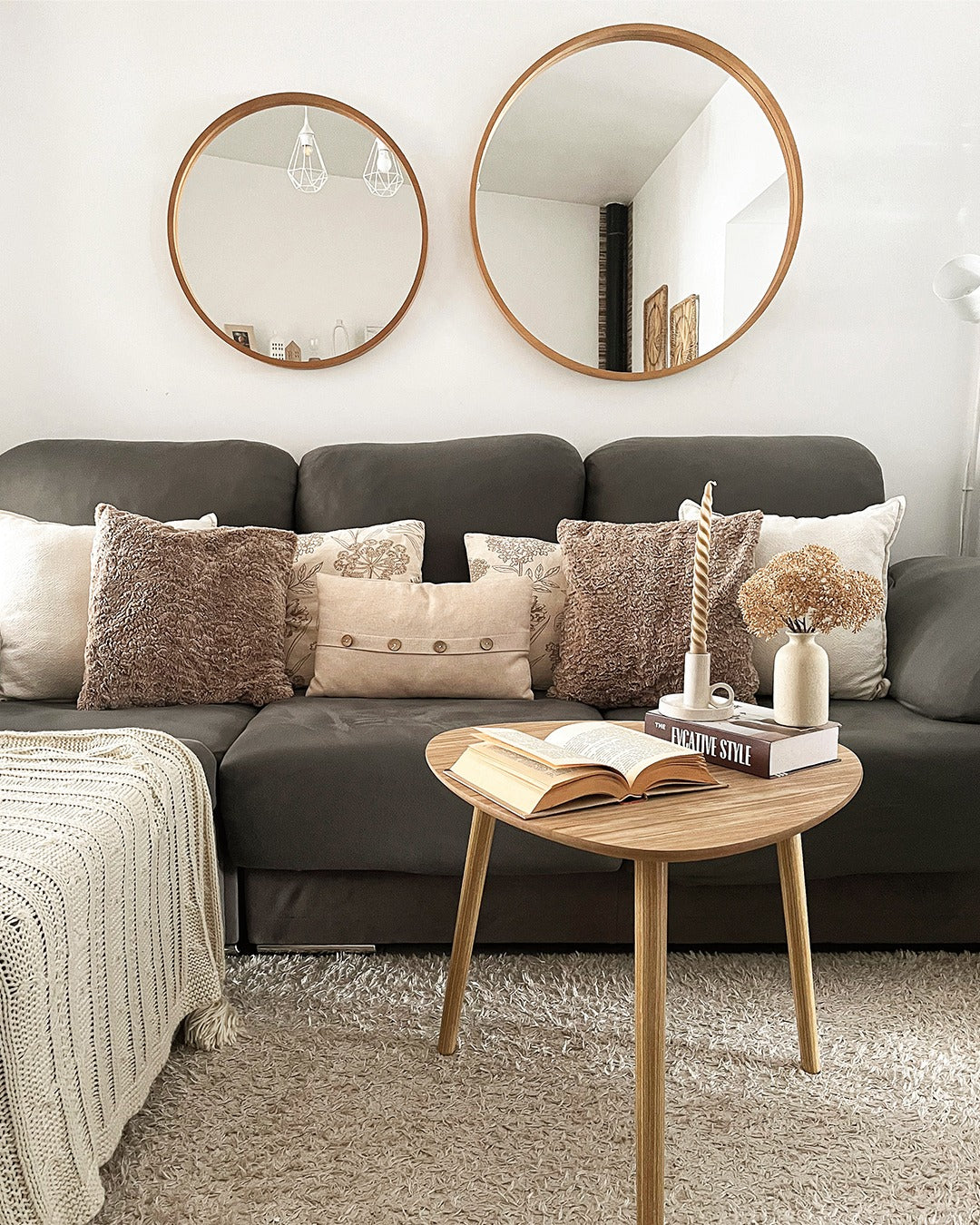 9. Scandinavian Simplicity with Rounded Reflections (Mirrors in Living Room Ideas)
