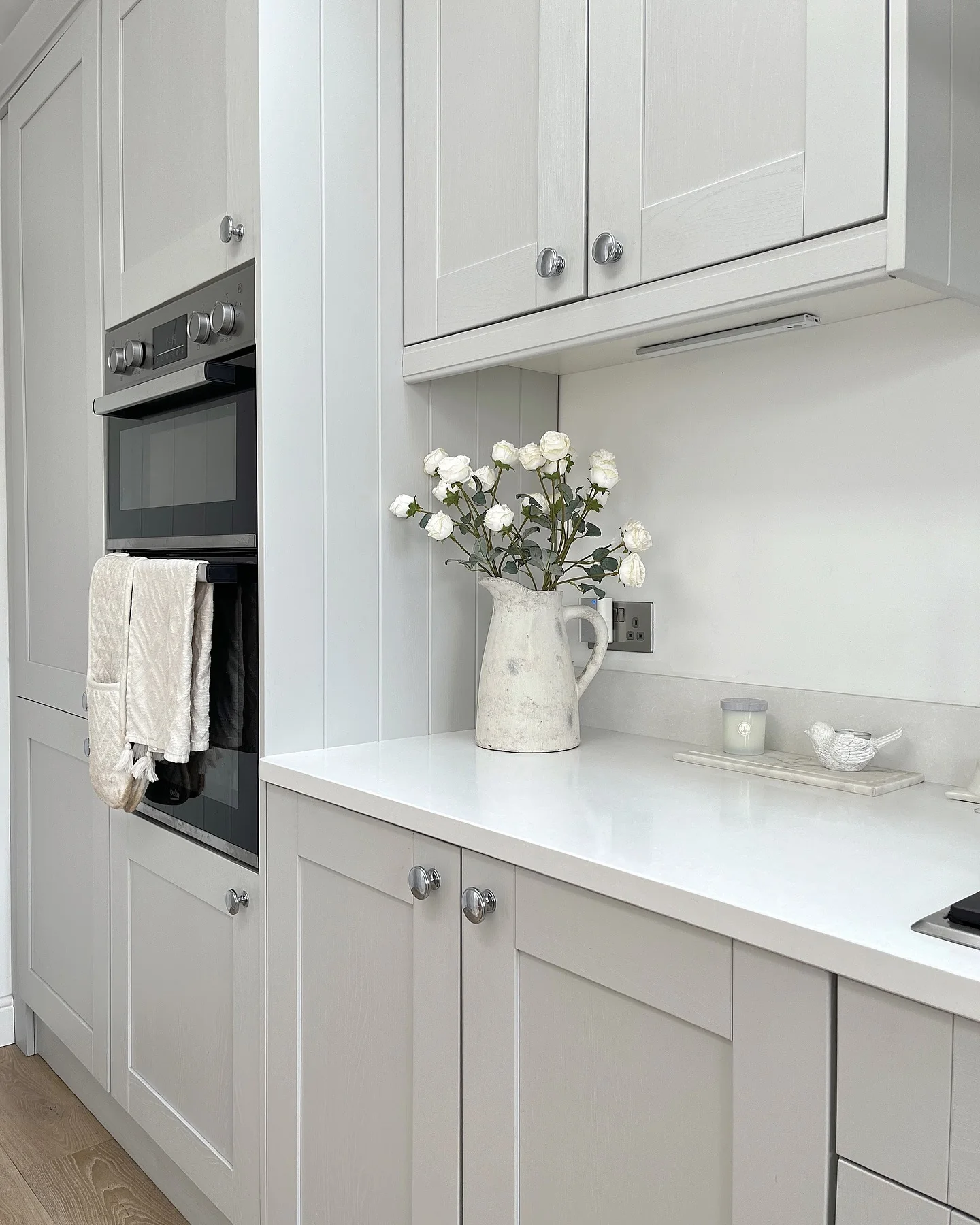 3. Bright Compact Design with Timeless Details (Light Gray Kitchen Ideas)