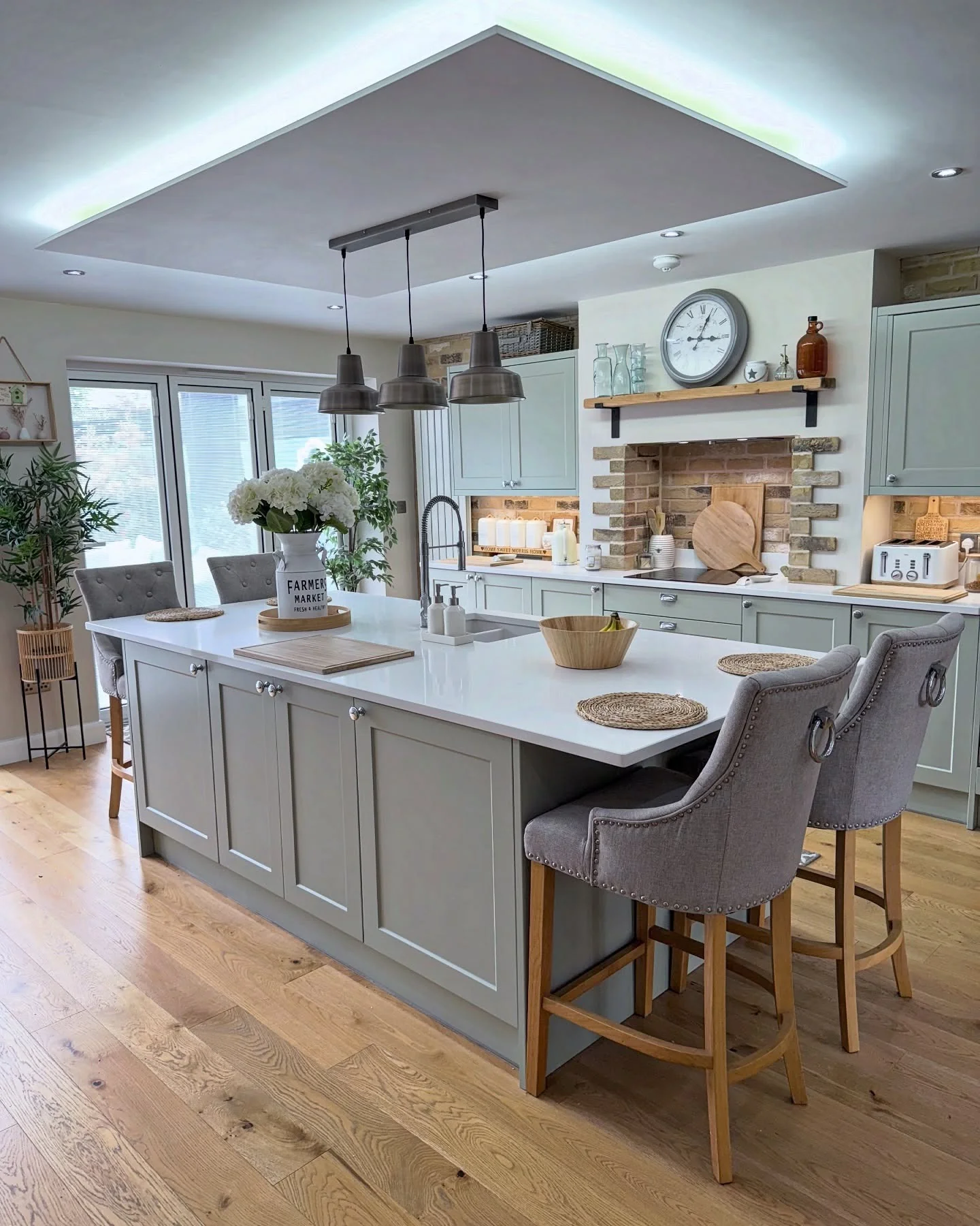 13. Inviting Farmhouse Style with Brick and Wood Accents (Light Gray Kitchen Ideas)