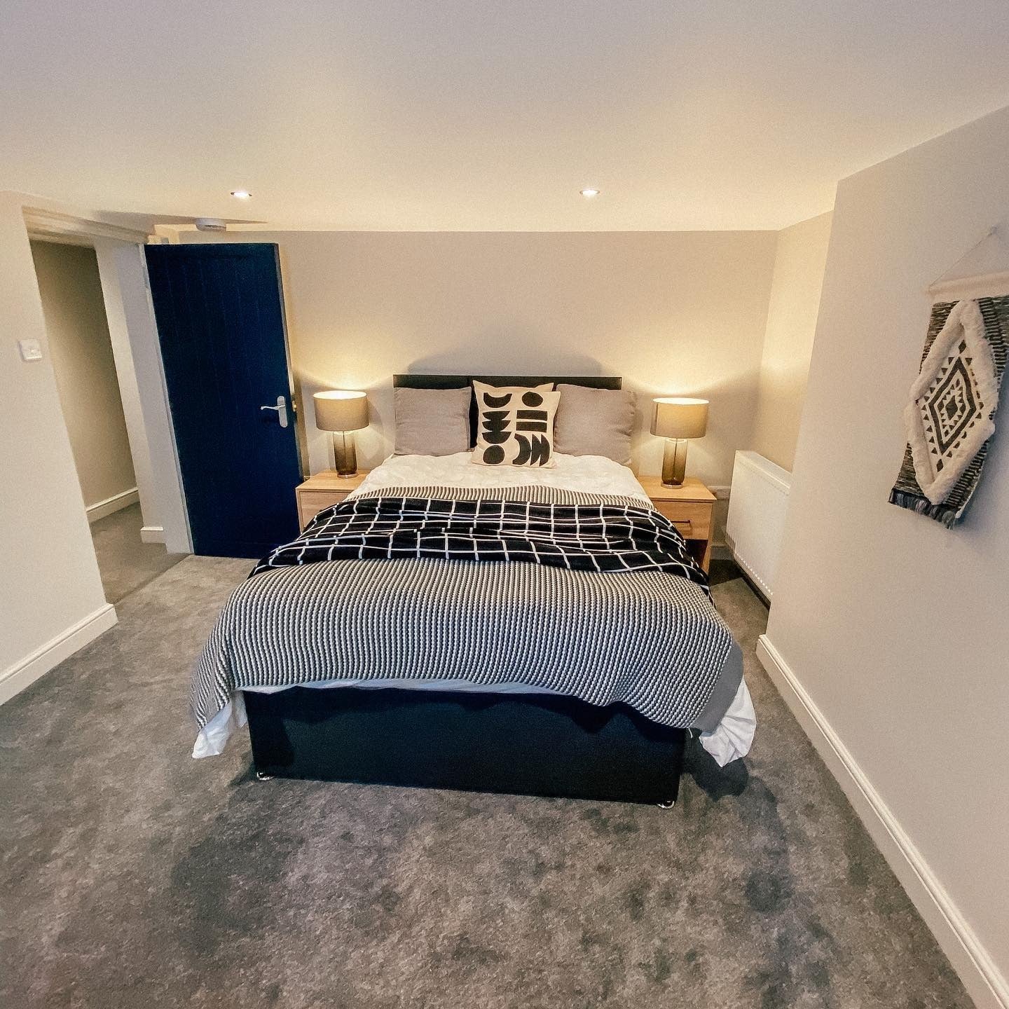 8. Monochrome Mod with Graphic Accents (Basement Bedroom Ideas)