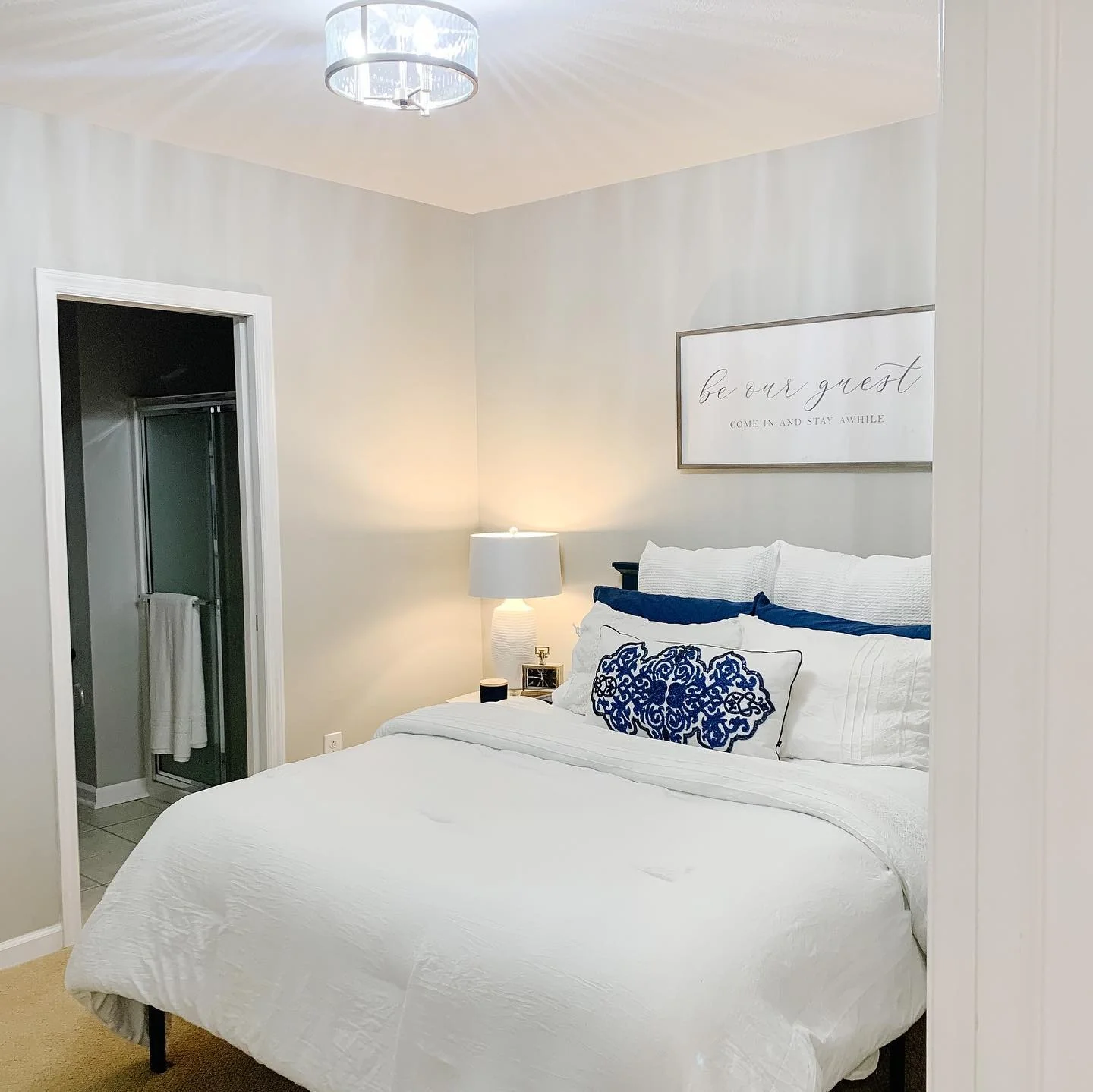 11. Crisp Contrast with Navy Accents (Basement Bedroom Ideas)