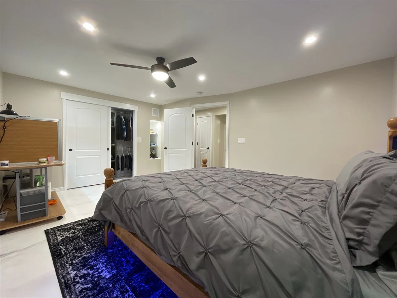 7. Sleek Minimalism with a Tech Edge (Basement Bedroom Ideas)