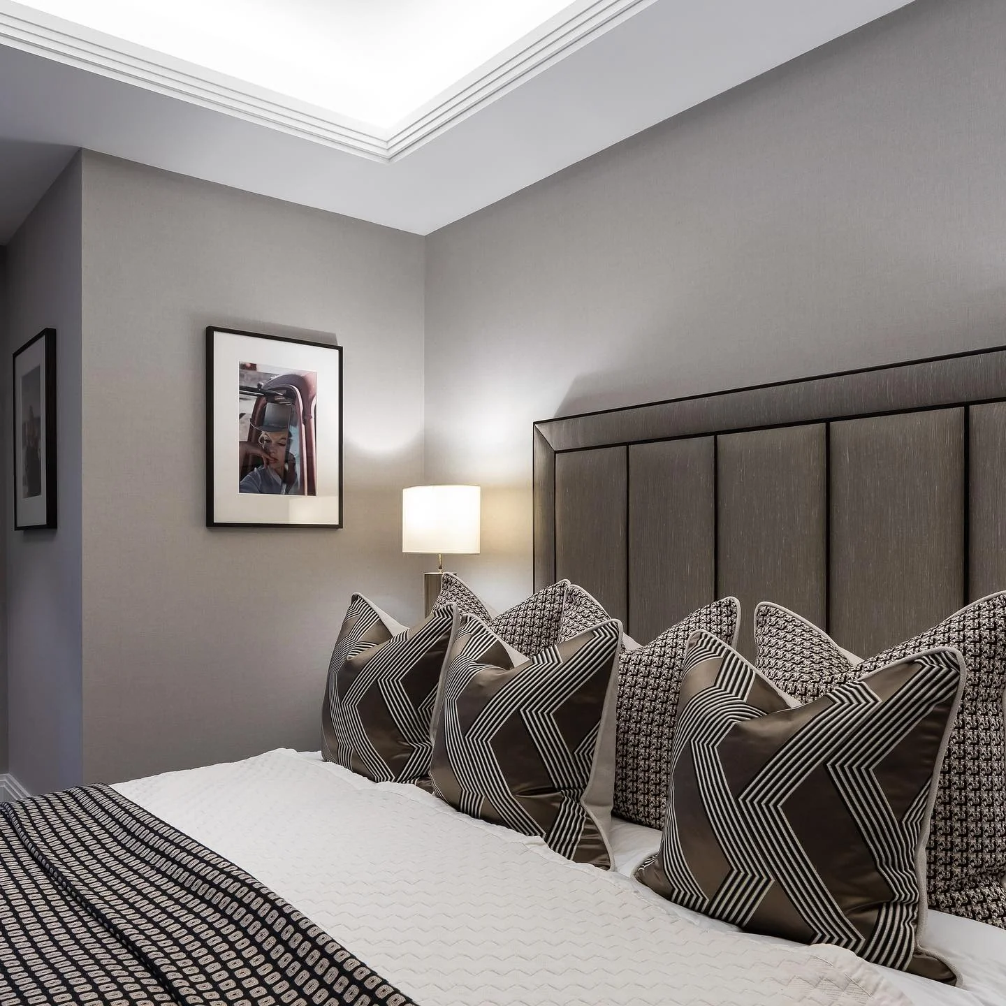 5. Sophisticated Monochrome Layers (Basement Bedroom Ideas)