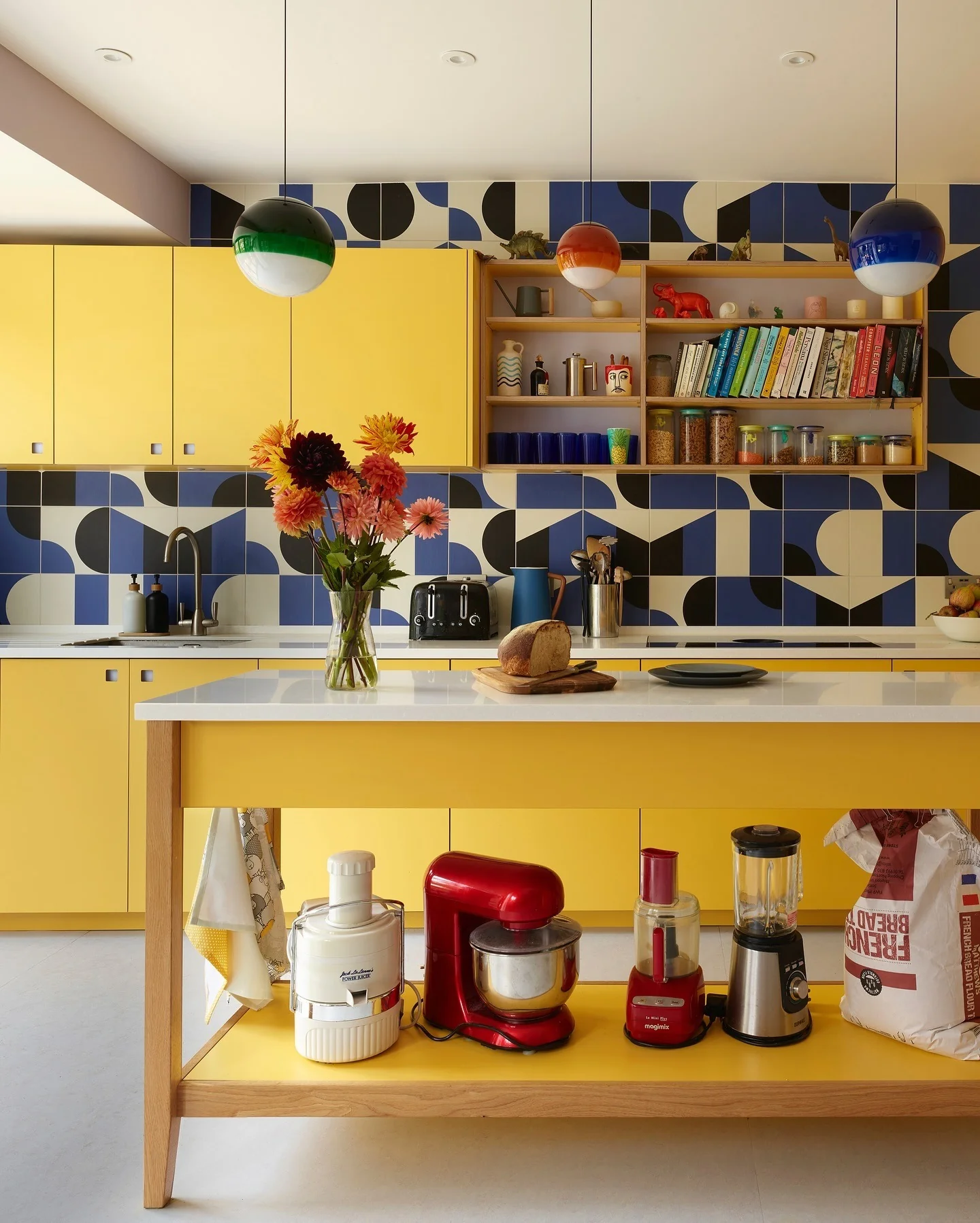 2. Modern Retro with Geometric Flair and Lemon Yellow Cabinets (Yellow Kitchen Ideas)