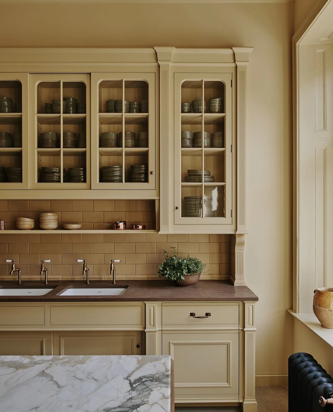 12. Creamy Ochre and Brownstone with Refined Cabinetry (Yellow Kitchen Ideas)