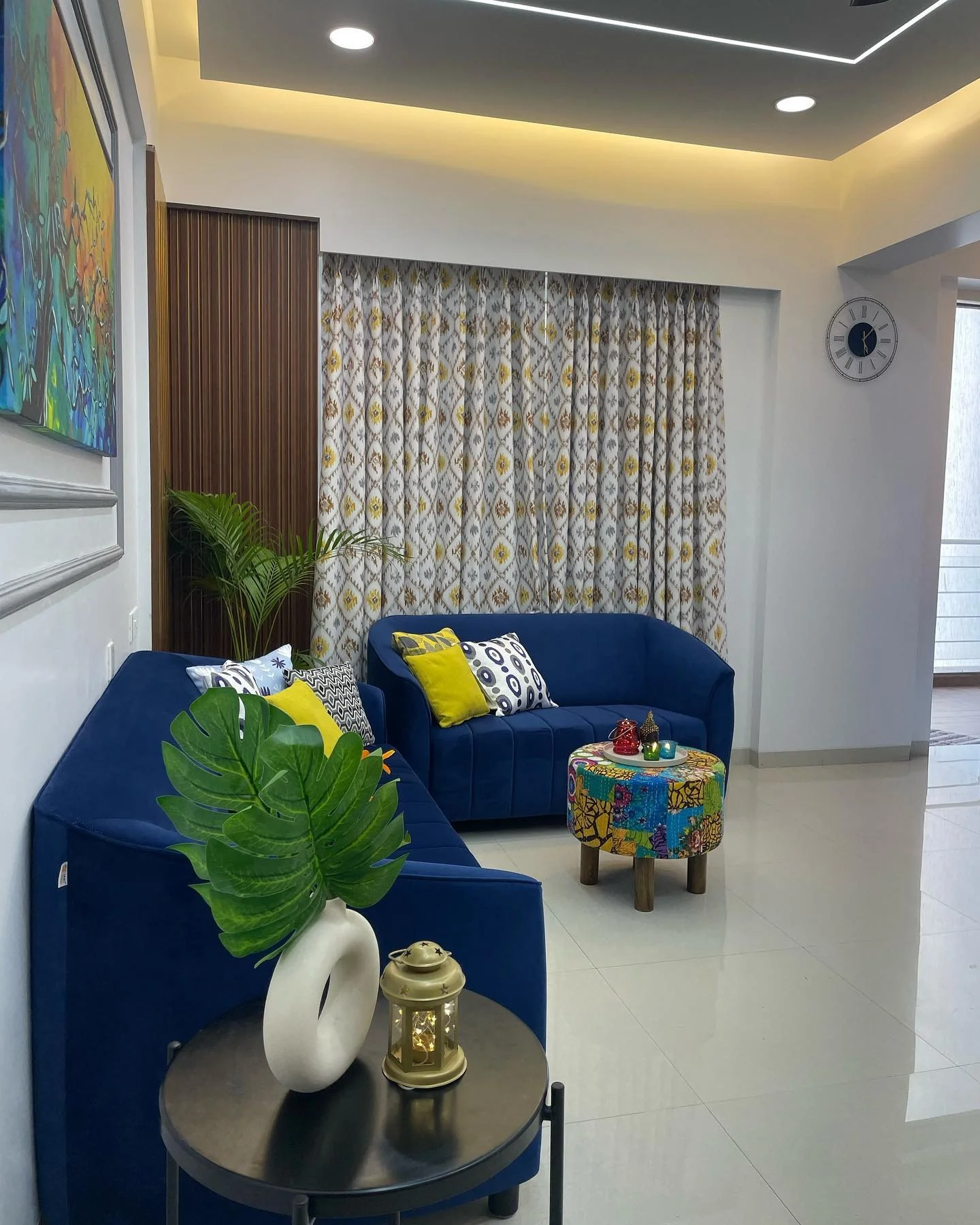 3. Colorful Urban Chic with Playful Accents (Royal Blue Living Room Ideas)