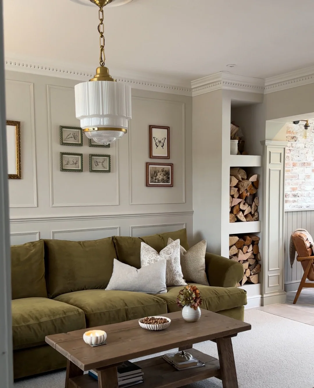 11. Olive Green Comfort with Heritage-Inspired Pendant (Lighting Ideas for Living Room)