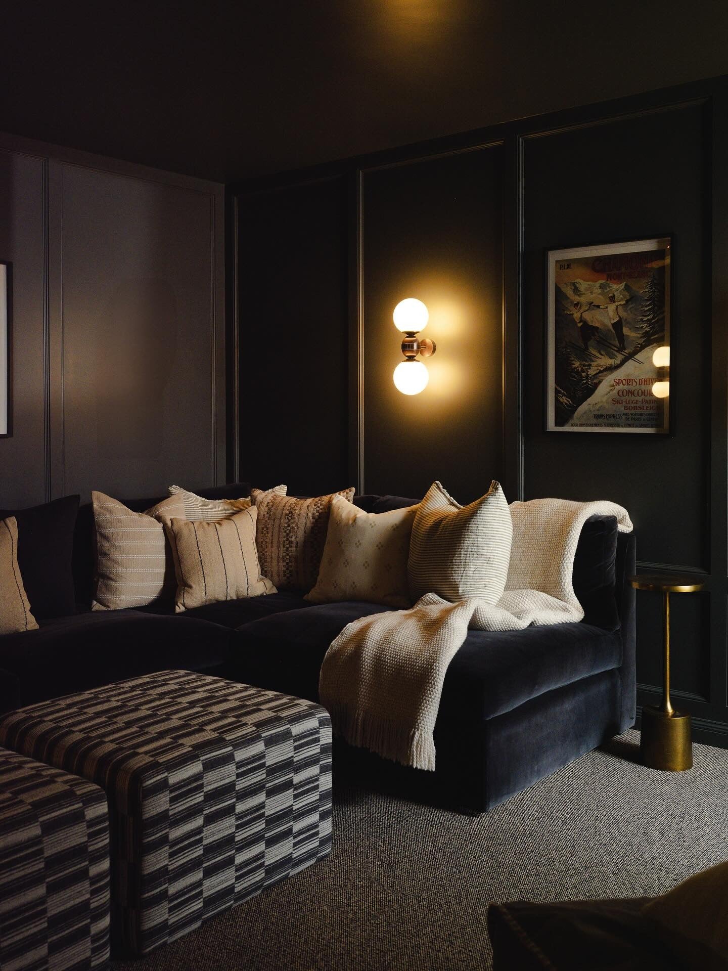 13. Cinematic Mood with Matte Layers (Dark Brown Living Room Ideas)