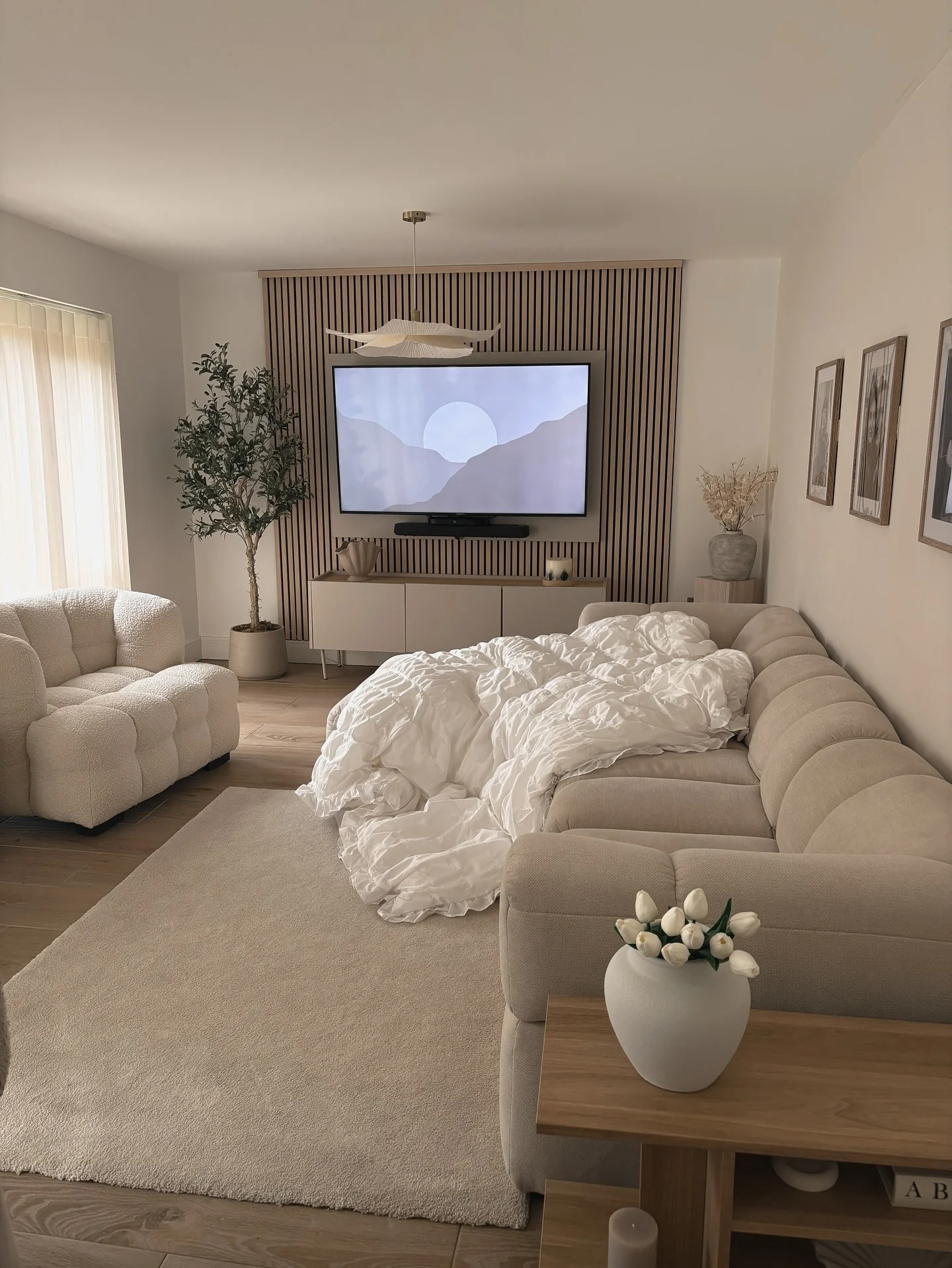 4. Warm Neutrals with Wood Panel Accents (Rectangle Living Room Ideas)