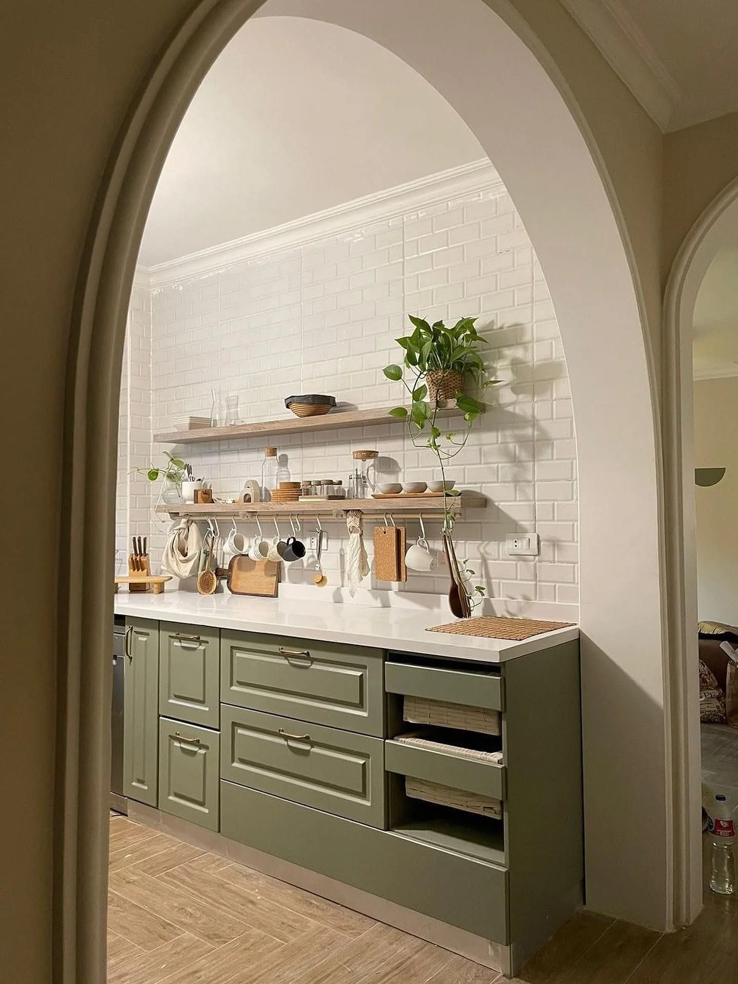 11. Olive Green Cabinets Framed by Arched Entry (Kitchen Ideas with Shelves)