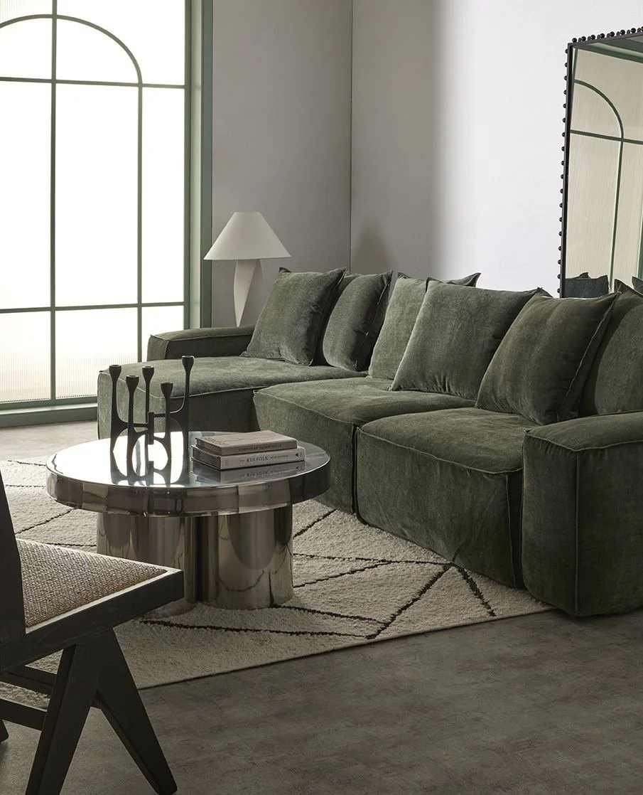 10. Modern Moody Minimalist Room with Olive Modular Sectional (Green Couch Living Room Ideas)