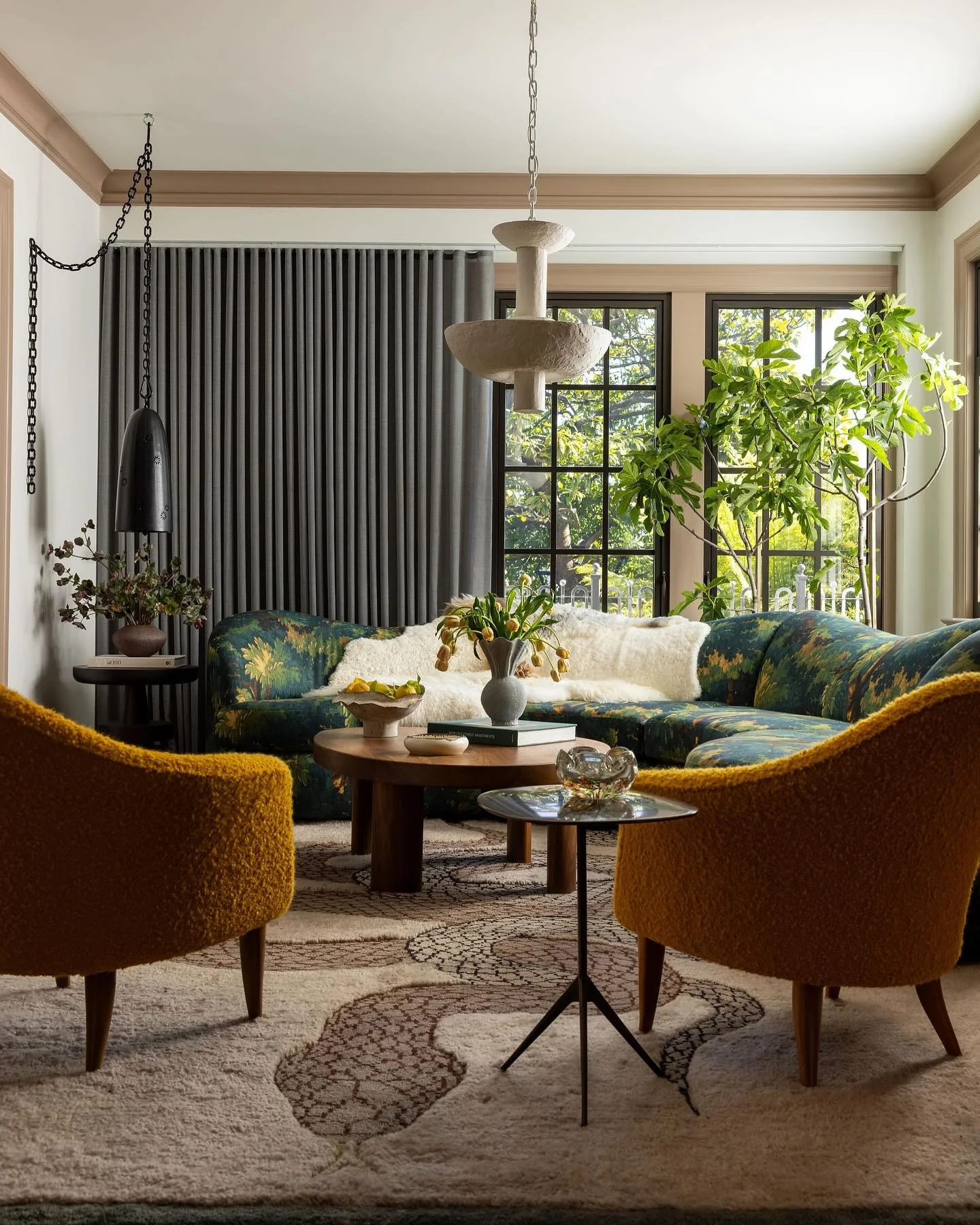 8. Artful Living Room with Green Patterned Sofa and Ochre Chairs (Green Couch Living Room Ideas)