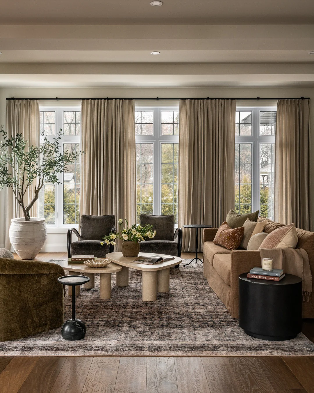 11. Layered Earth Tones with Distressed Rug (Living Room Carpet Ideas)