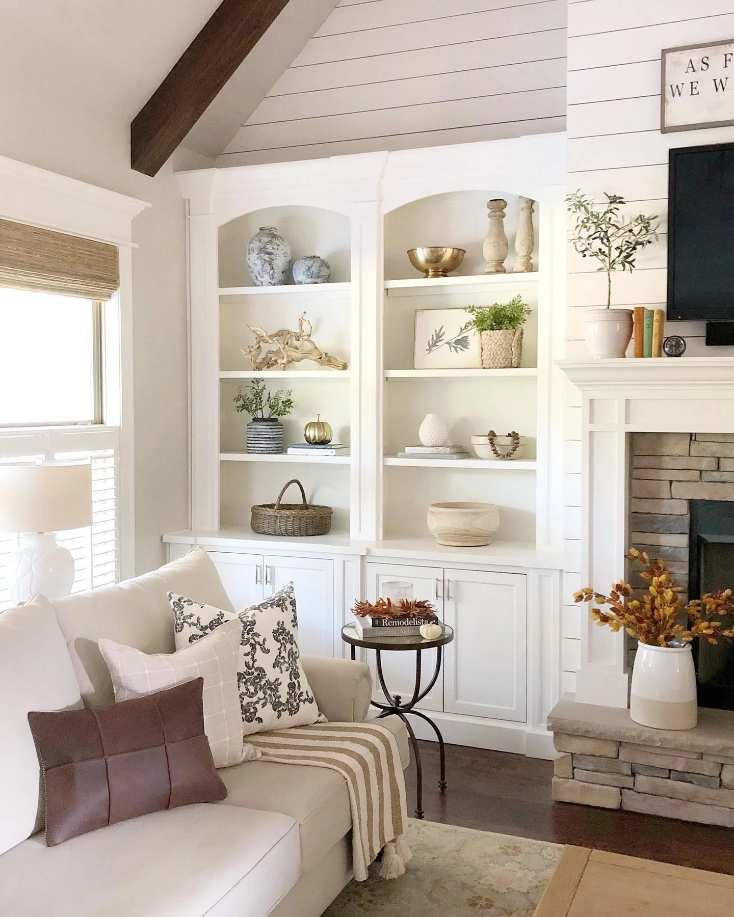 14. Classic Arched Built-Ins in Soft Whites (Living Room Shelf Ideas)